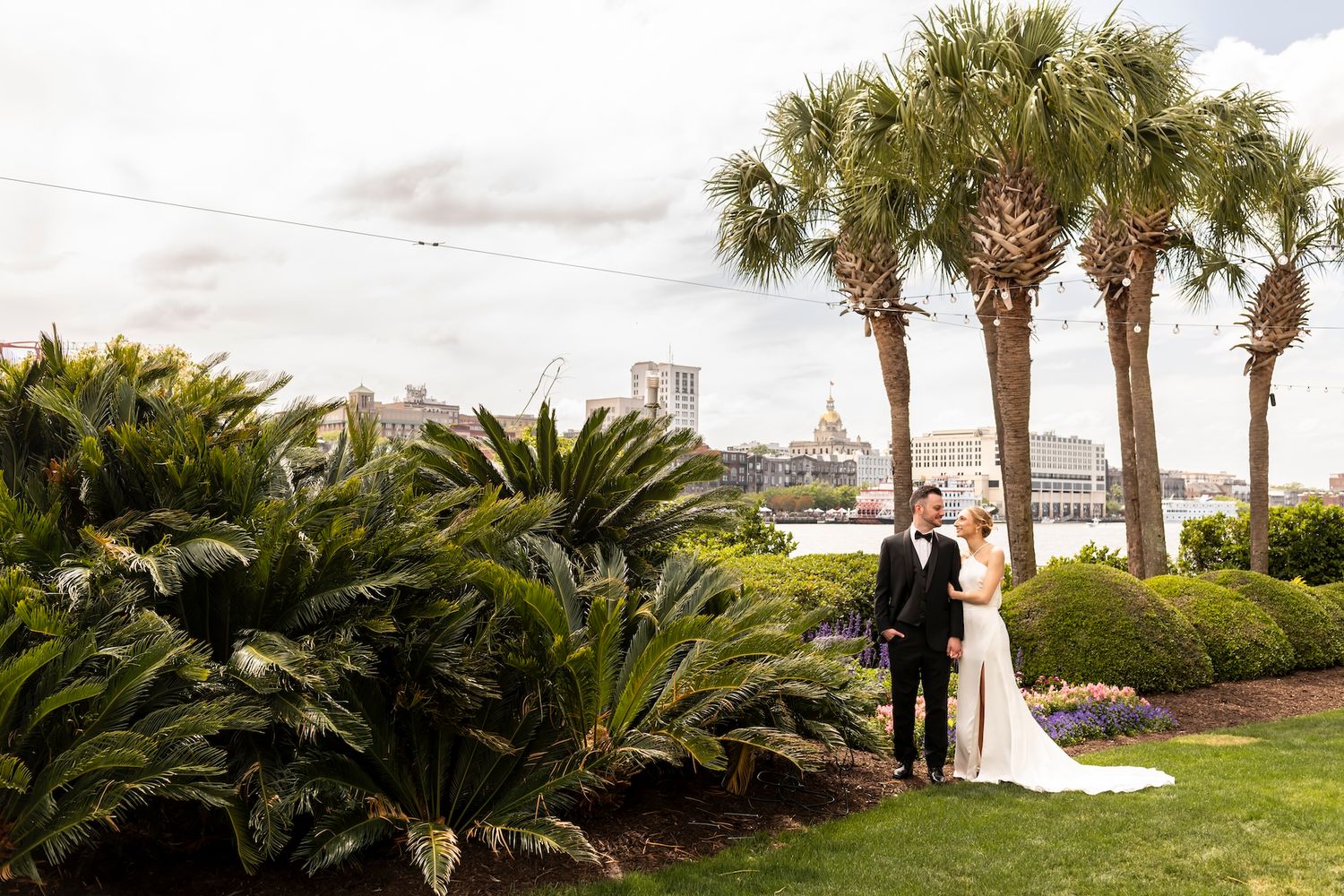 Bride and groom portraits at waterfront gazebo at Westin Savannah Harbor.