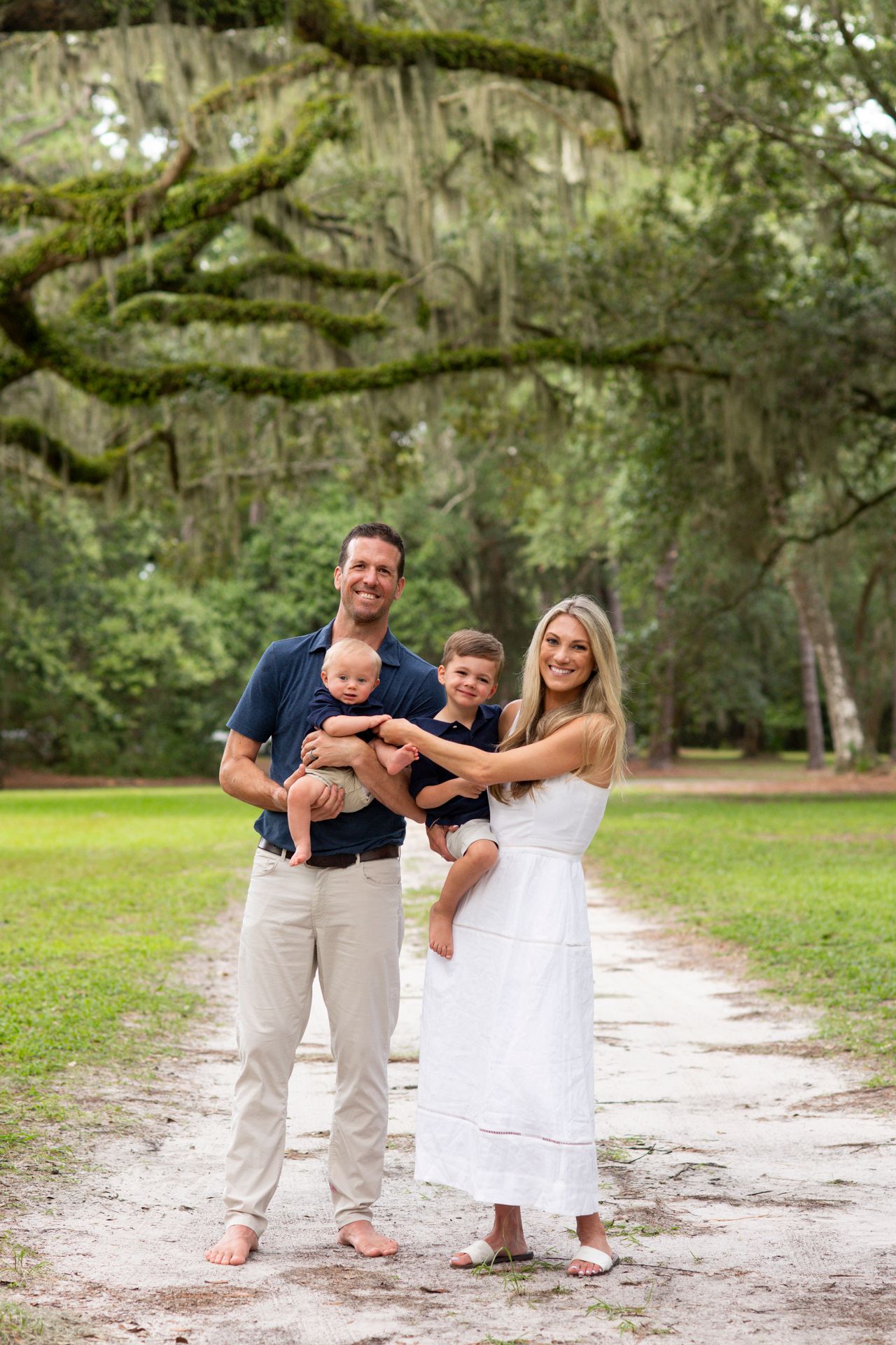 Family portraits under moss-covered oak trees at Six Oaks in Hilton Head