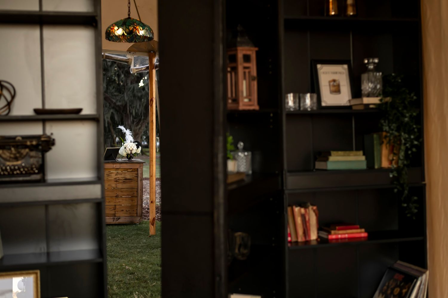 Cozy modern interior with dark wood built-in cabinets, shelving units and warm lighting creating an elegant home atmosphere.