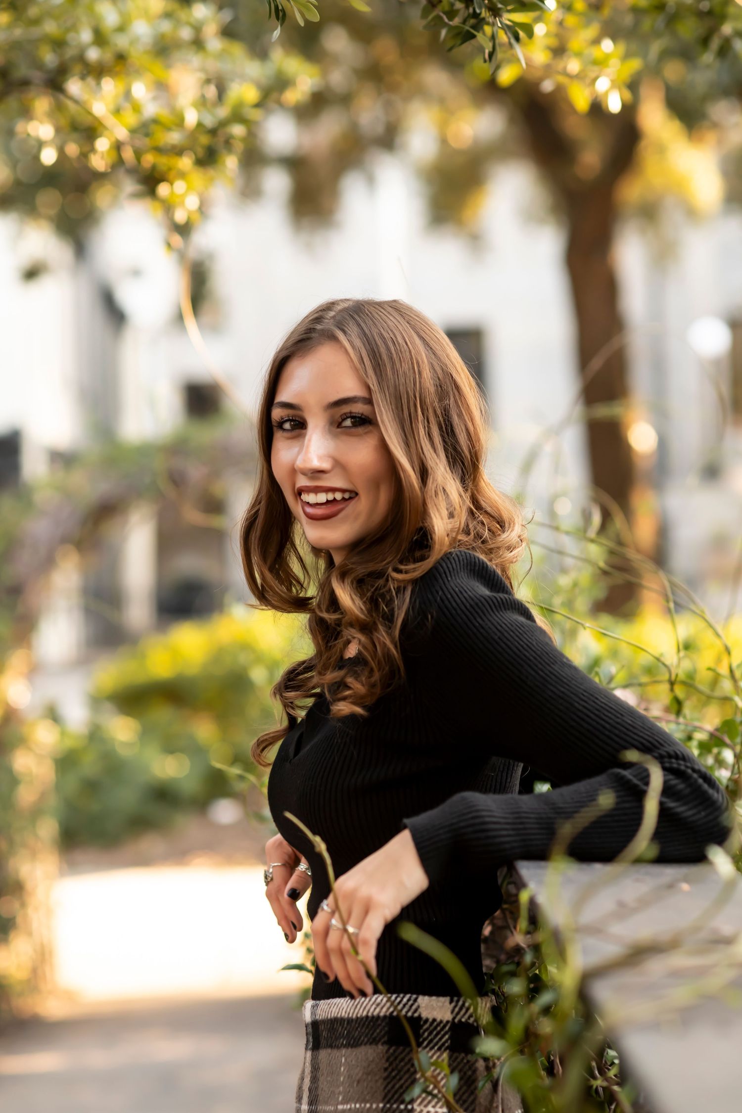 A high school senior poses for her senior portraits in Savannah