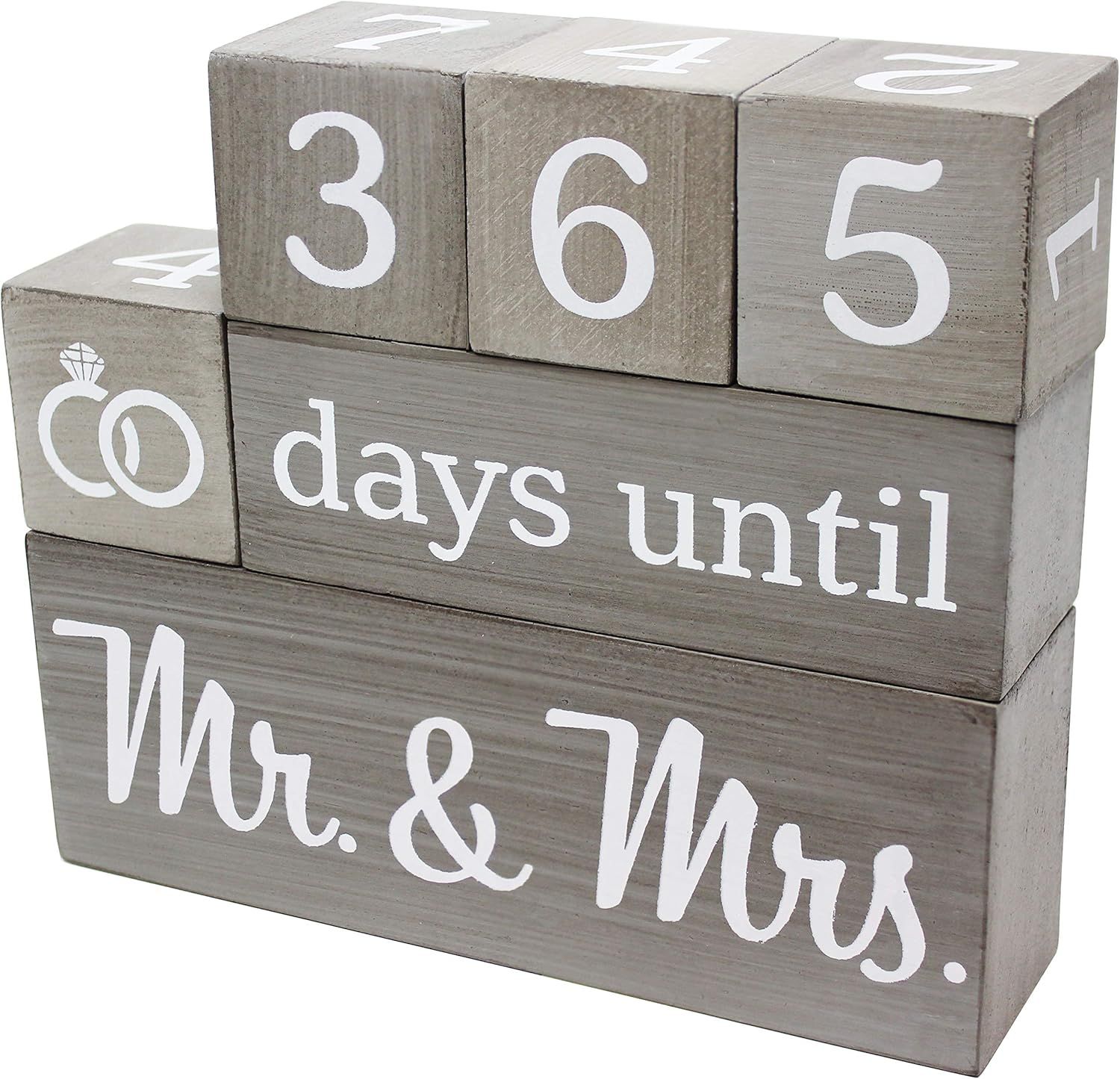 Gray wooden countdown blocks displaying days until a wedding celebration with Mr & Mrs text in white letters.