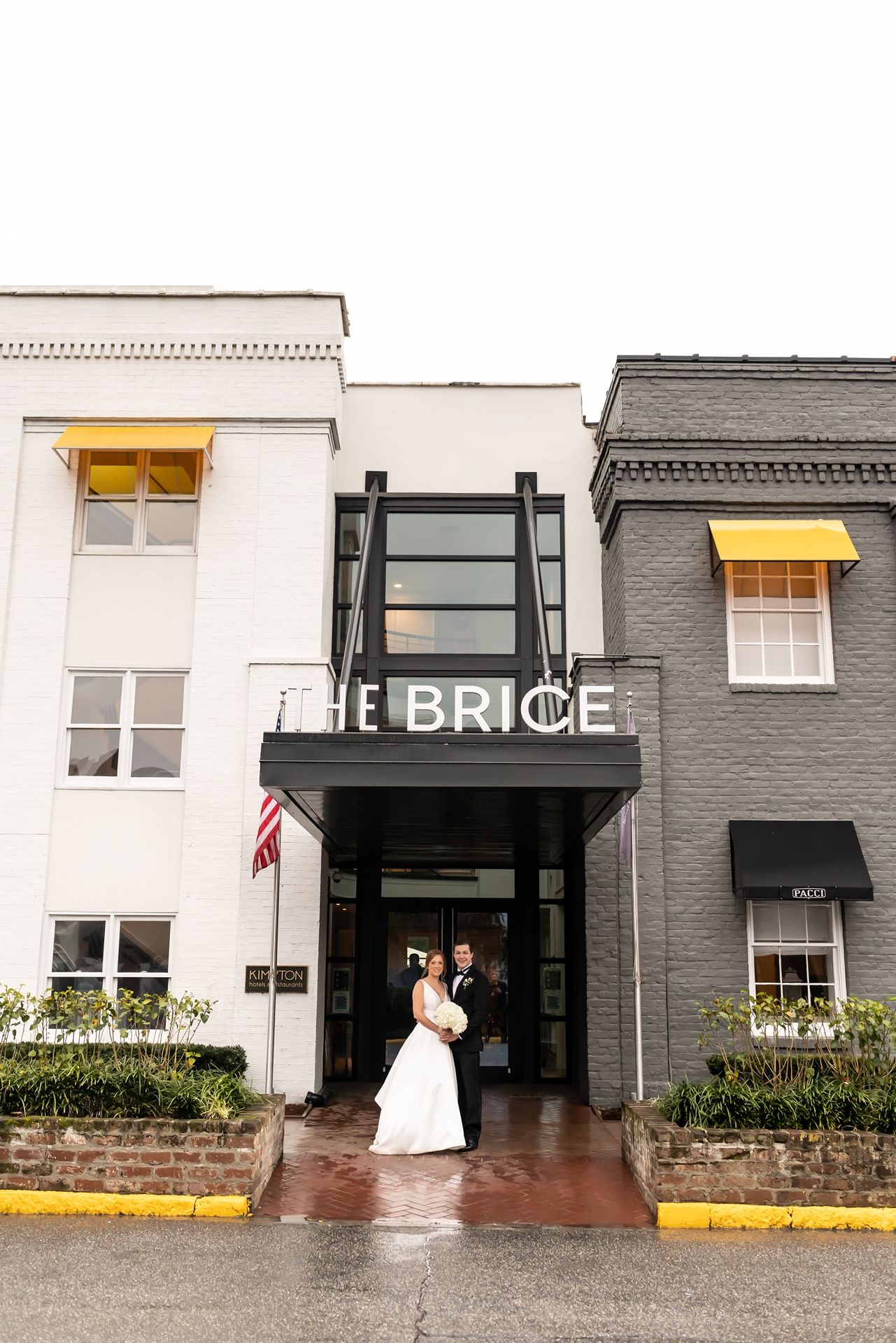 Panoramic wedding photo sequence showing four views of bride and groom entering The Brice hotel entrance in the rain.