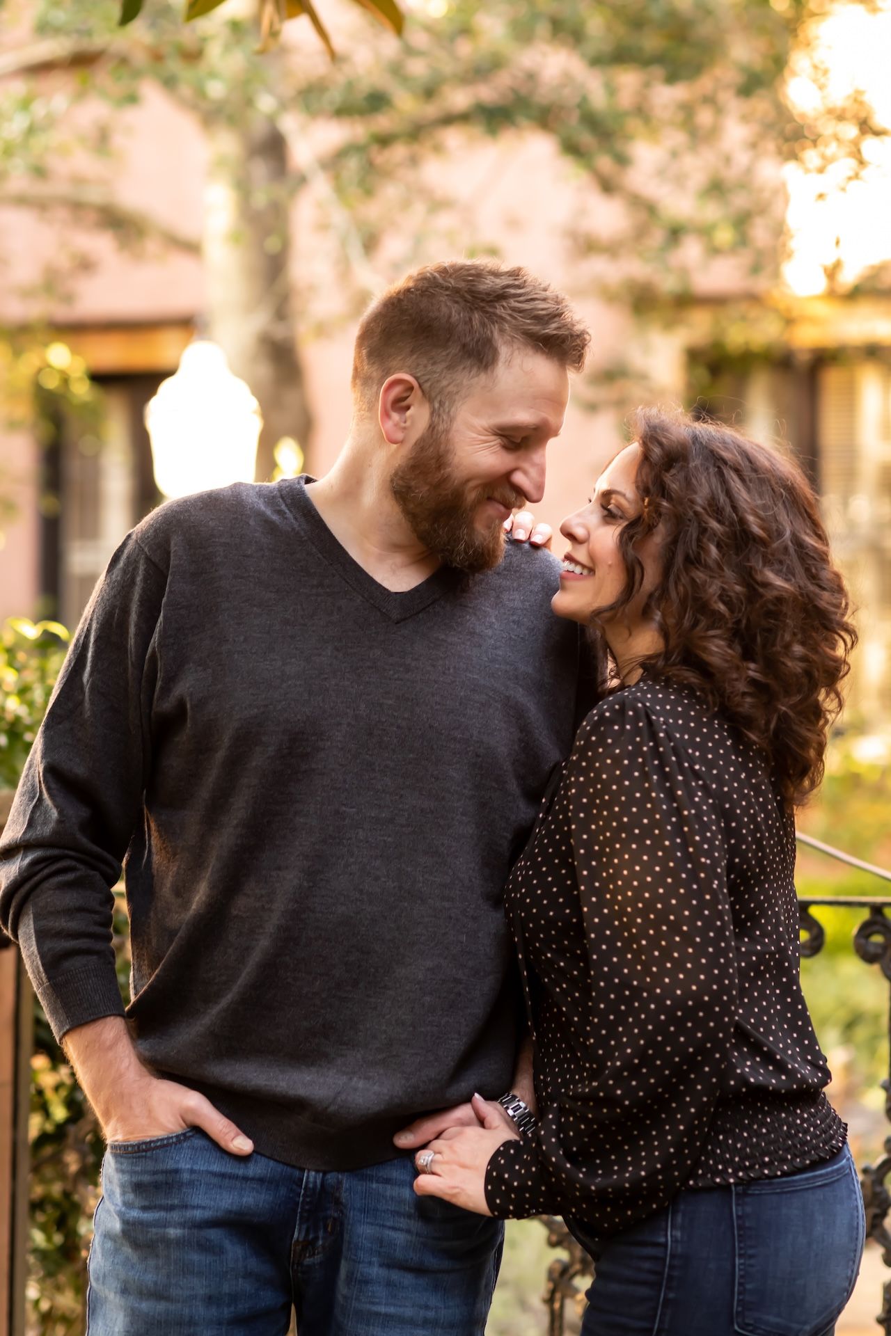 Engagement photos in Savannah square with oak trees.