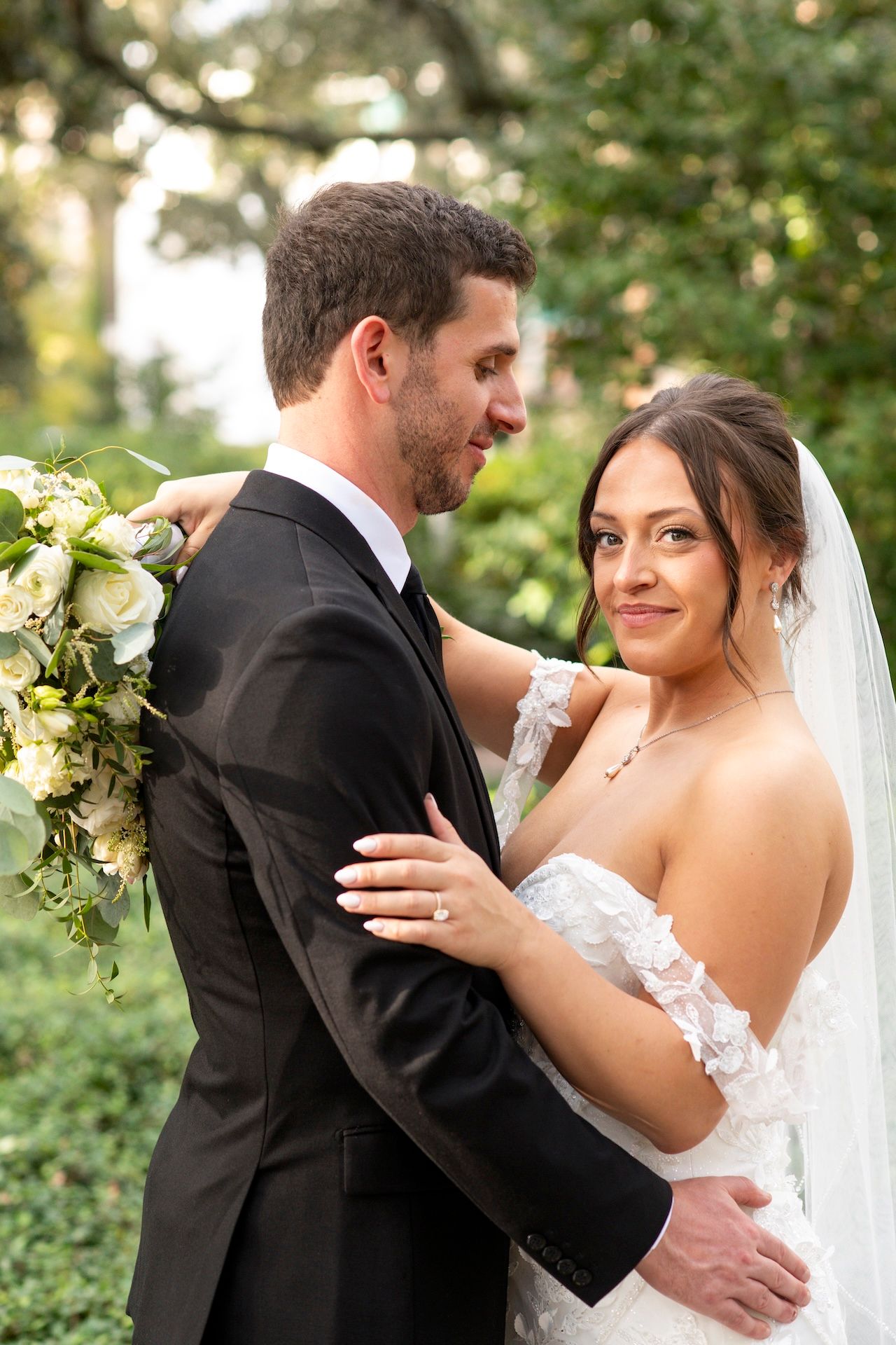 A romantic sequence of wedding photos showing a couple dancing and embracing in an outdoor garden setting.