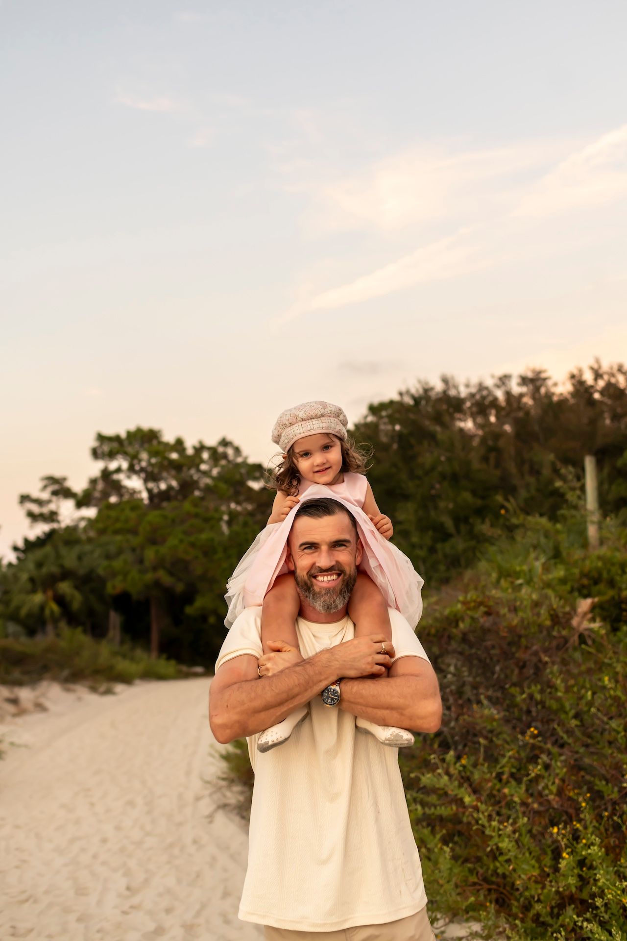 Series of photos showing person in beige clothing posing playfully against a beach landscape at sunset.