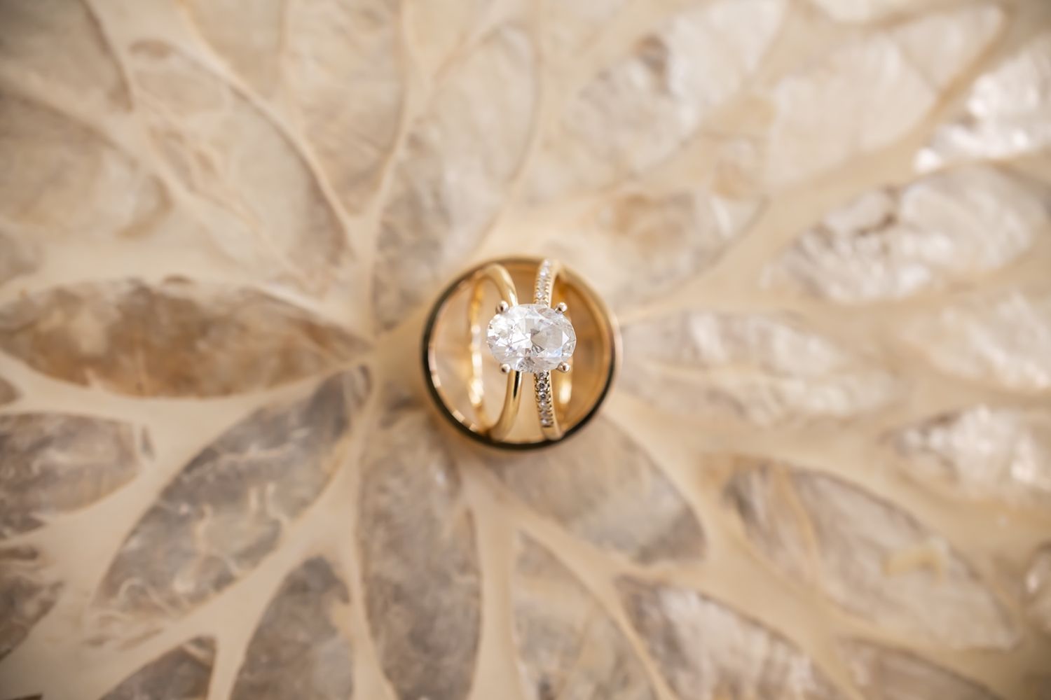 Sparkling crystals and jewel facets reflect kaleidoscopic light patterns in a repeating artistic arrangement.