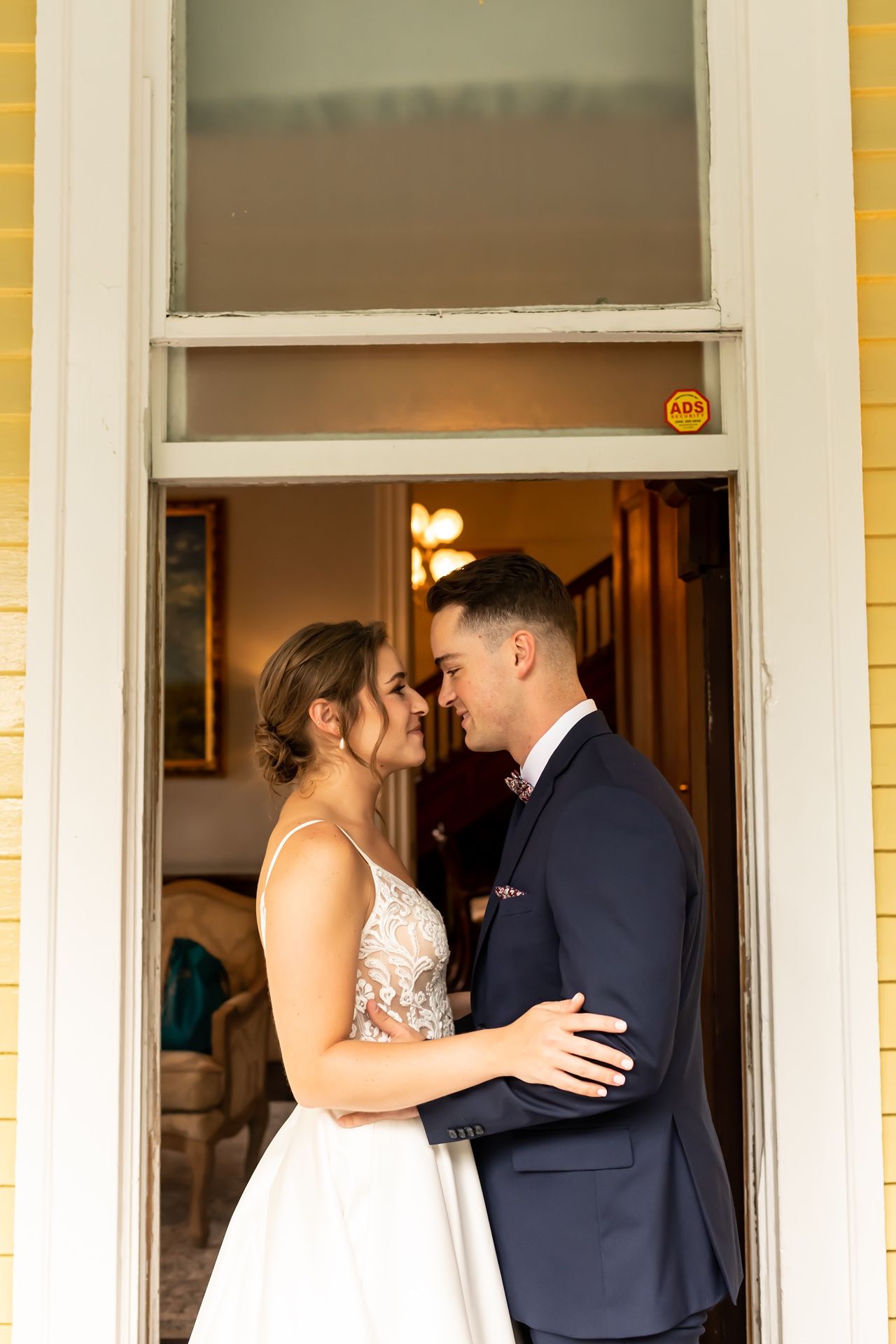 A wedding couple shares an intimate moment on a front porch with yellow walls, captured in sequential frames.