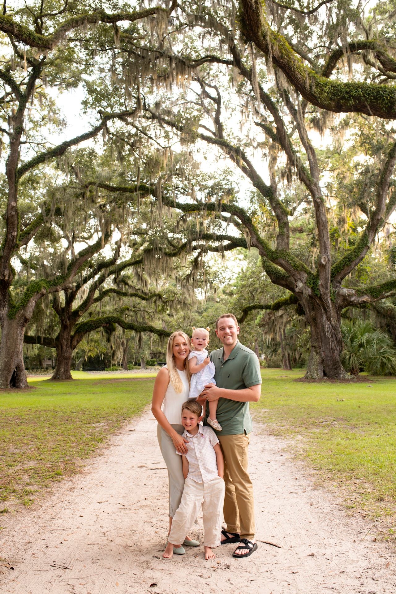 Family portrait on a tree-lined path in Sea Pines on Hilton Head Island.