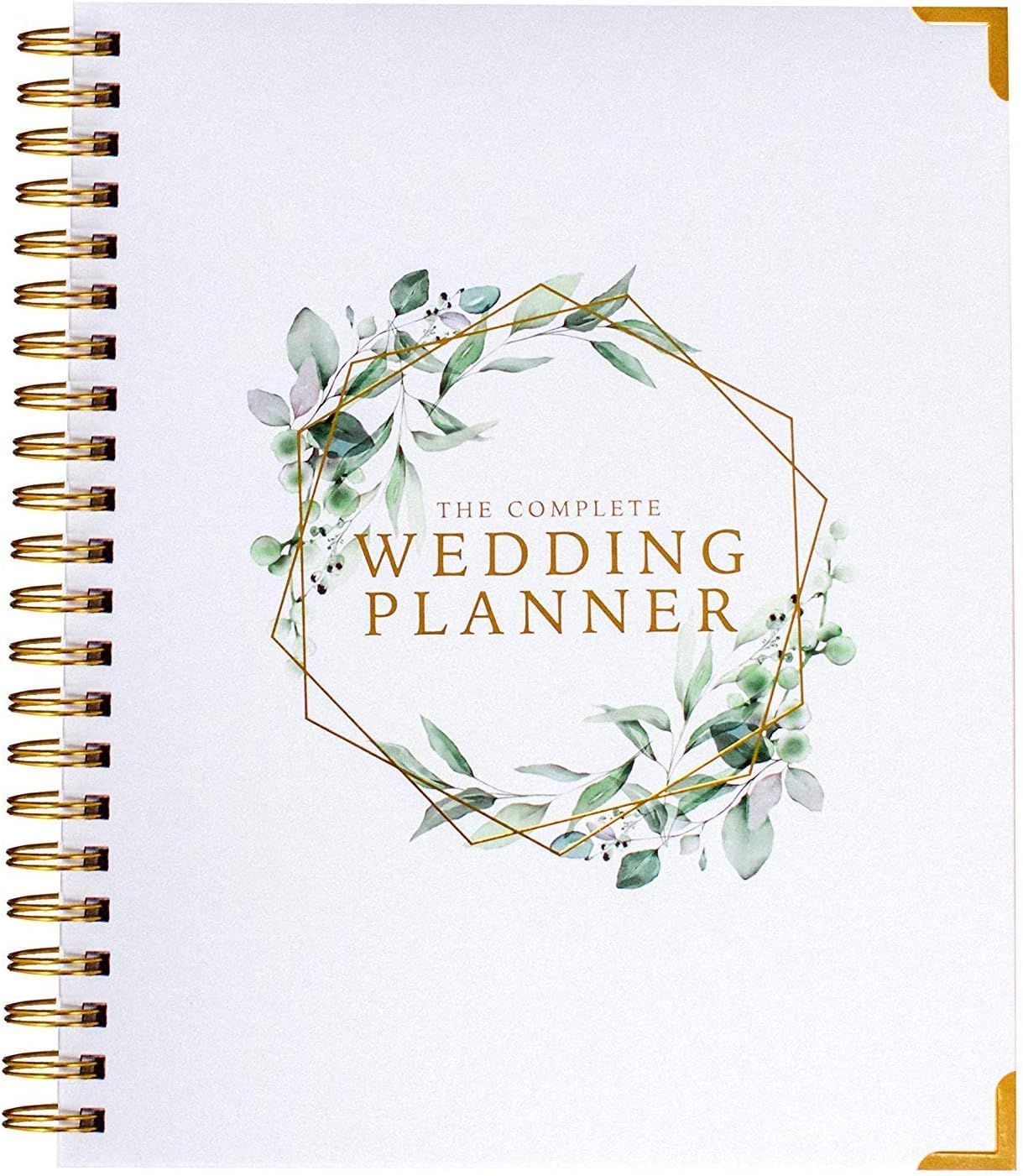 A spiral-bound wedding planner book cover with gold geometric frame and watercolor greenery floral design.