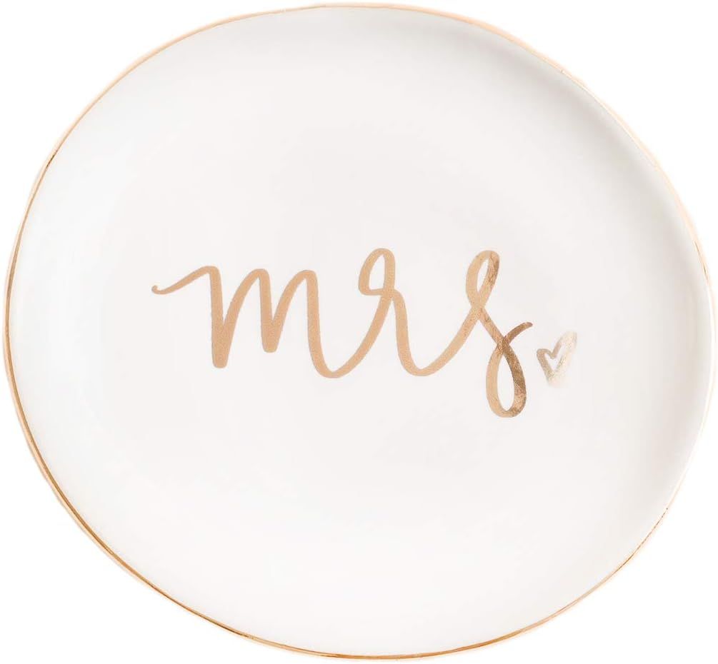 Row of plain white ceramic plates arranged with pale peach-colored text written on each plate.