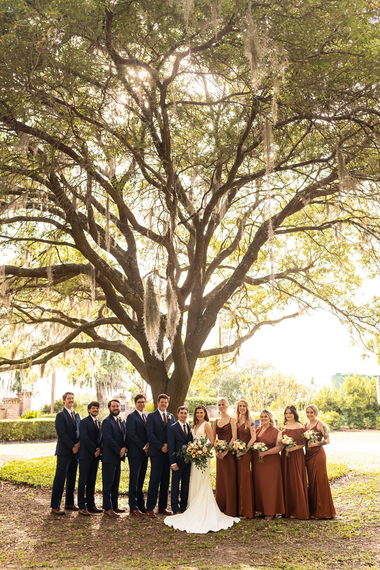 Panoramic sequence of elegant rustic wedding party photos under sprawling oak trees at golden hour.