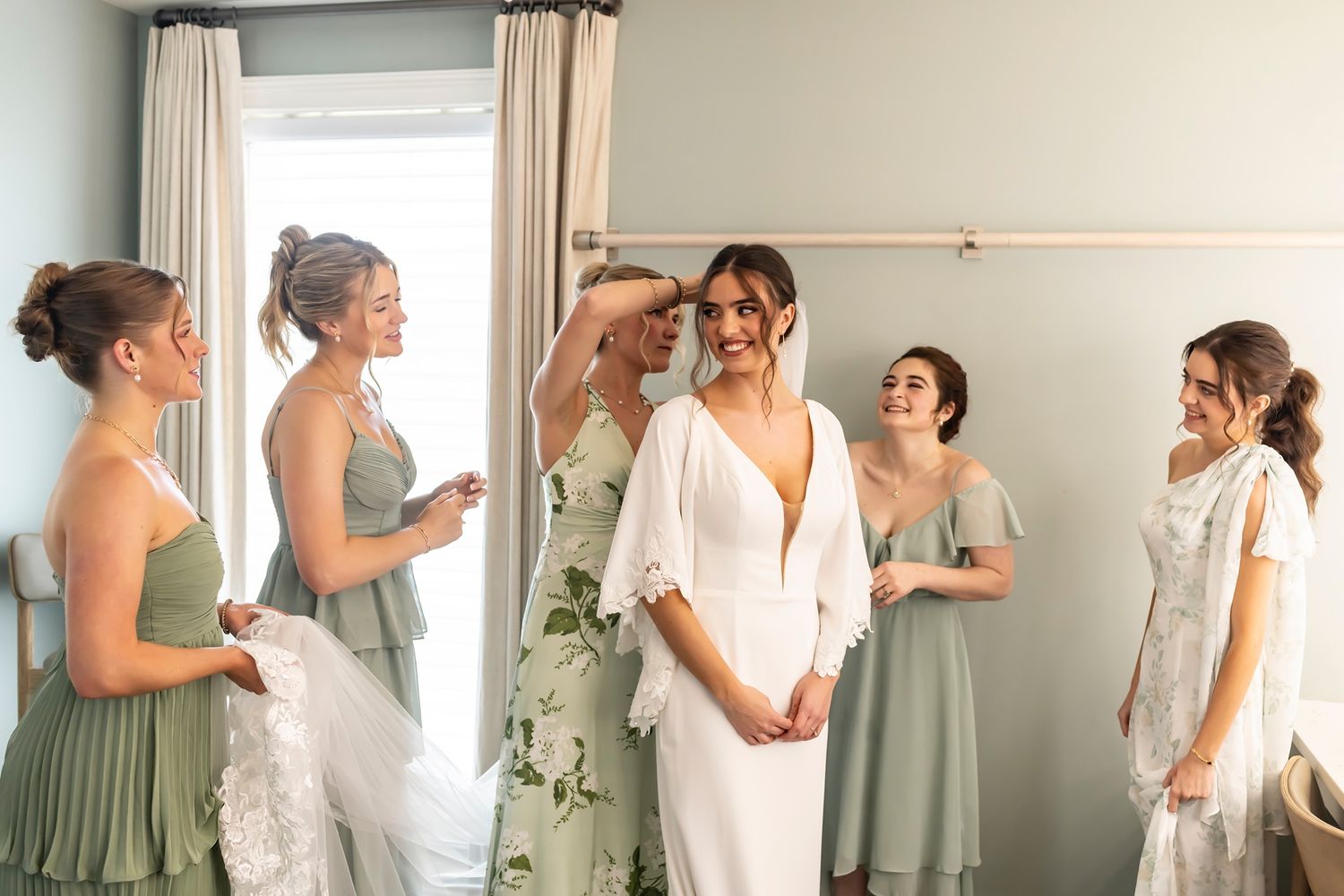 A series of candid moments captured of wedding party members preparing and getting ready together in matching outfits.