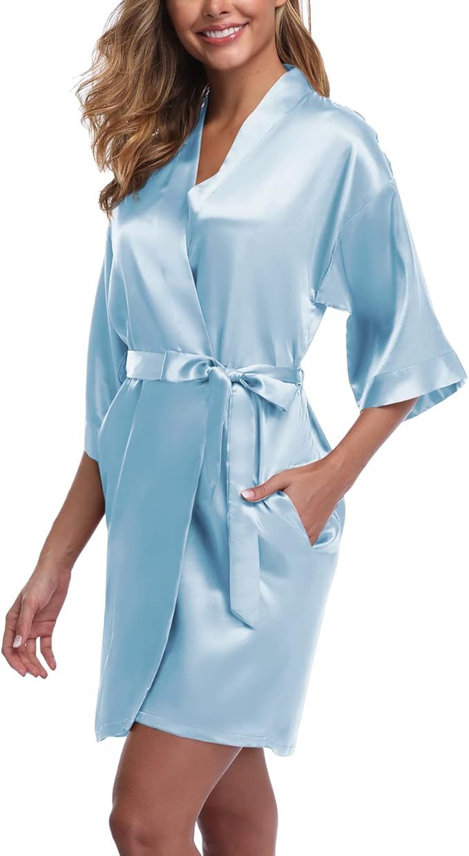 Light blue satin kimono robe with three-quarter length sleeves, v-neck, tie waist belt and side pockets.