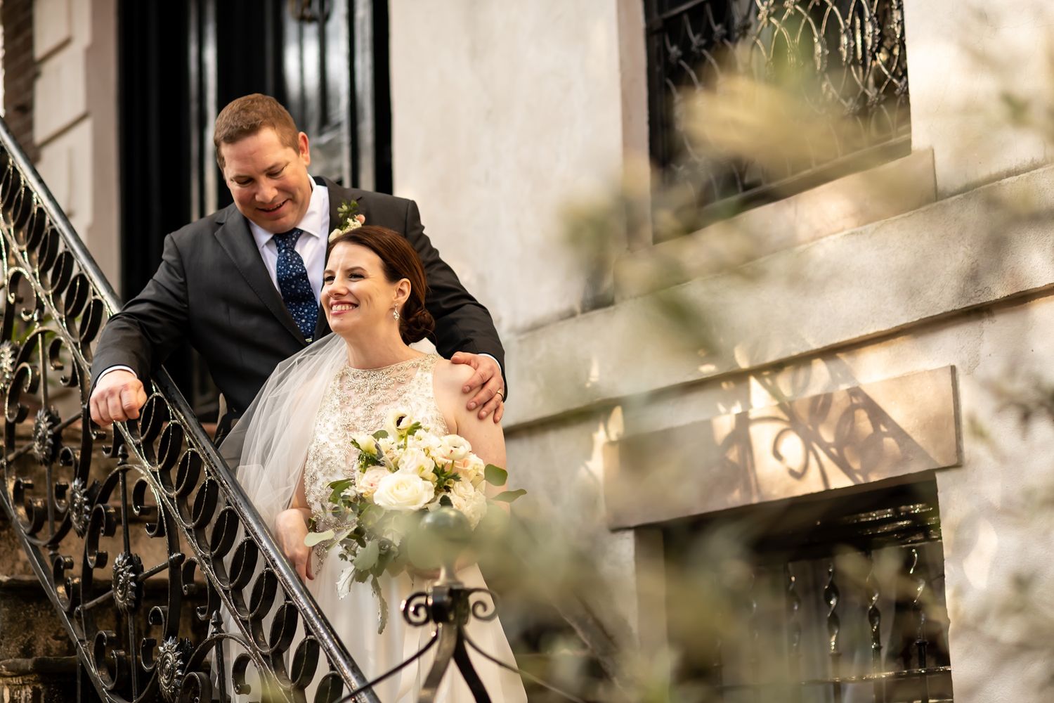 Bride and groom share an intimate moment while walking together on their wedding day.