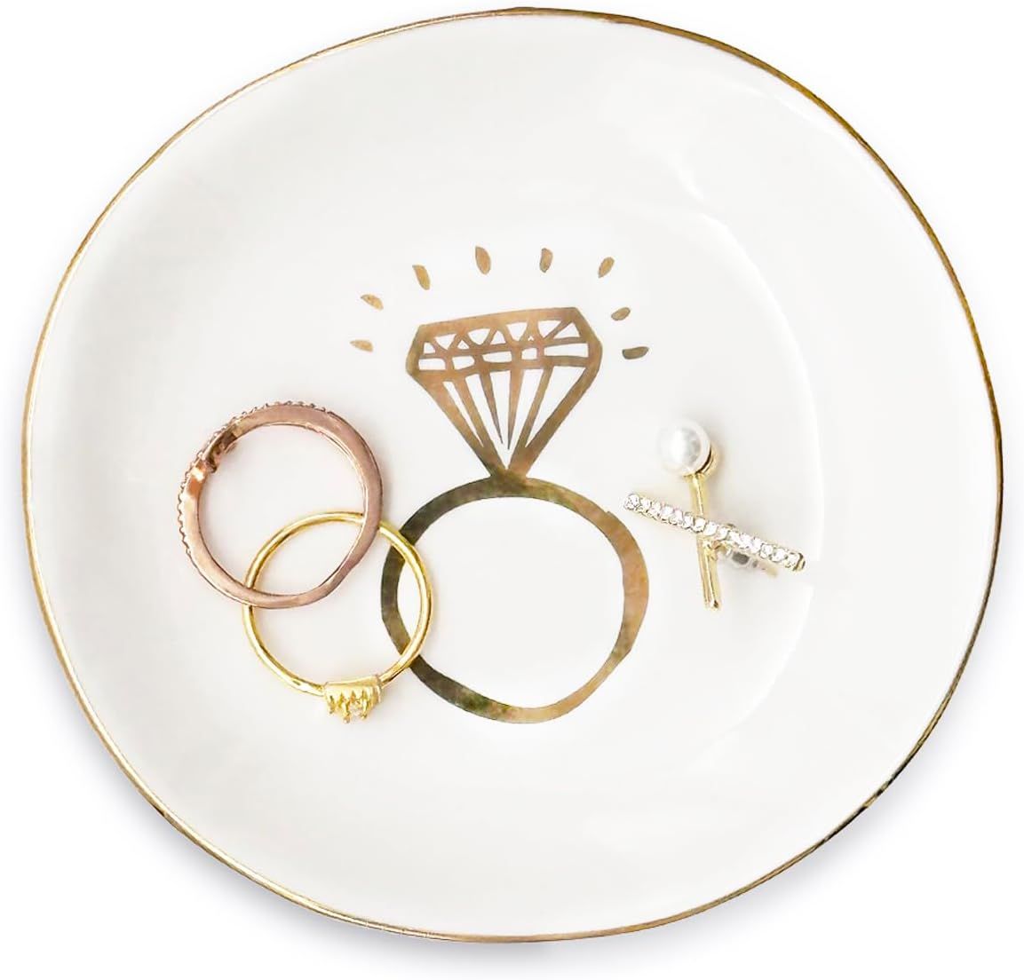 Set of five white ceramic trinket dishes with gold designs depicting different engagement ring illustrations.