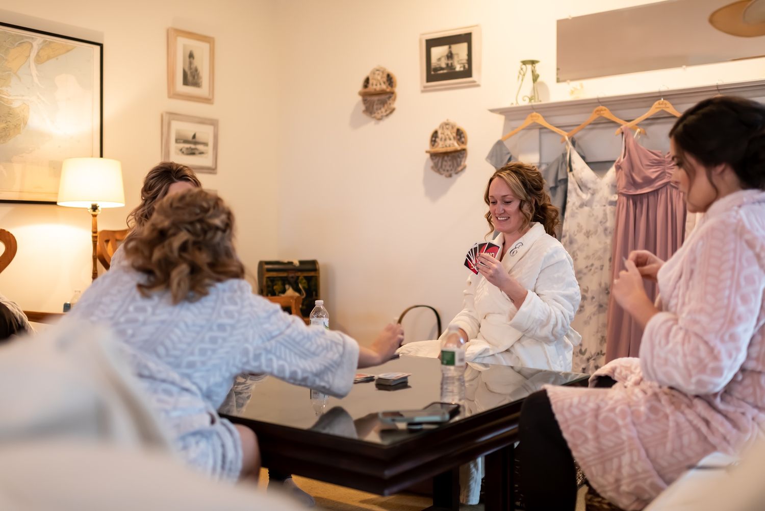 Students practice therapeutic massage techniques on clients while learning proper form and positioning in a spa training room.