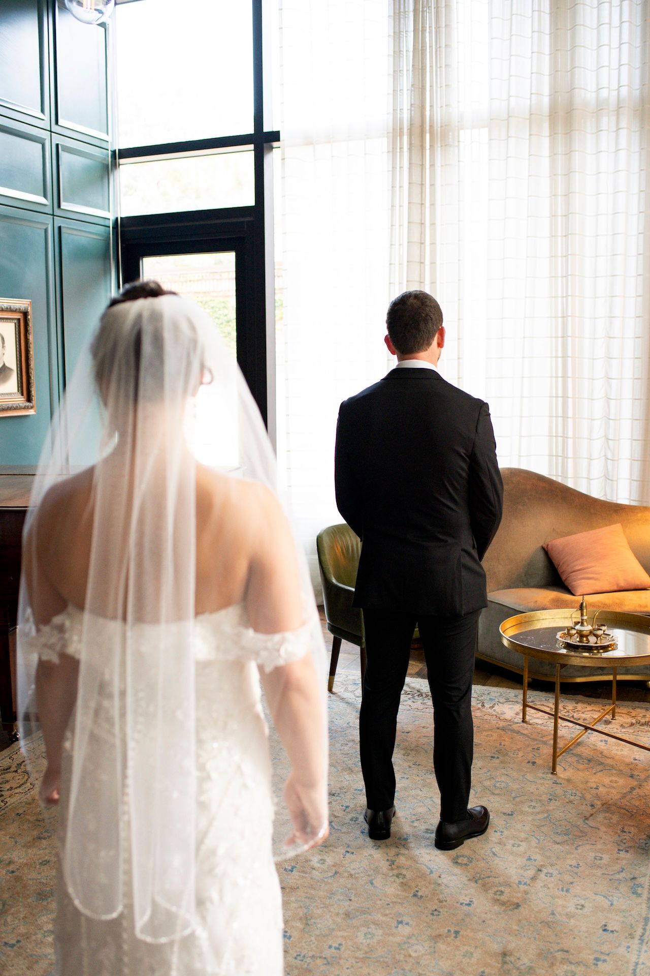 Bride and groom first look in Perry Lane Hotel Library in Savannah, Georgia.