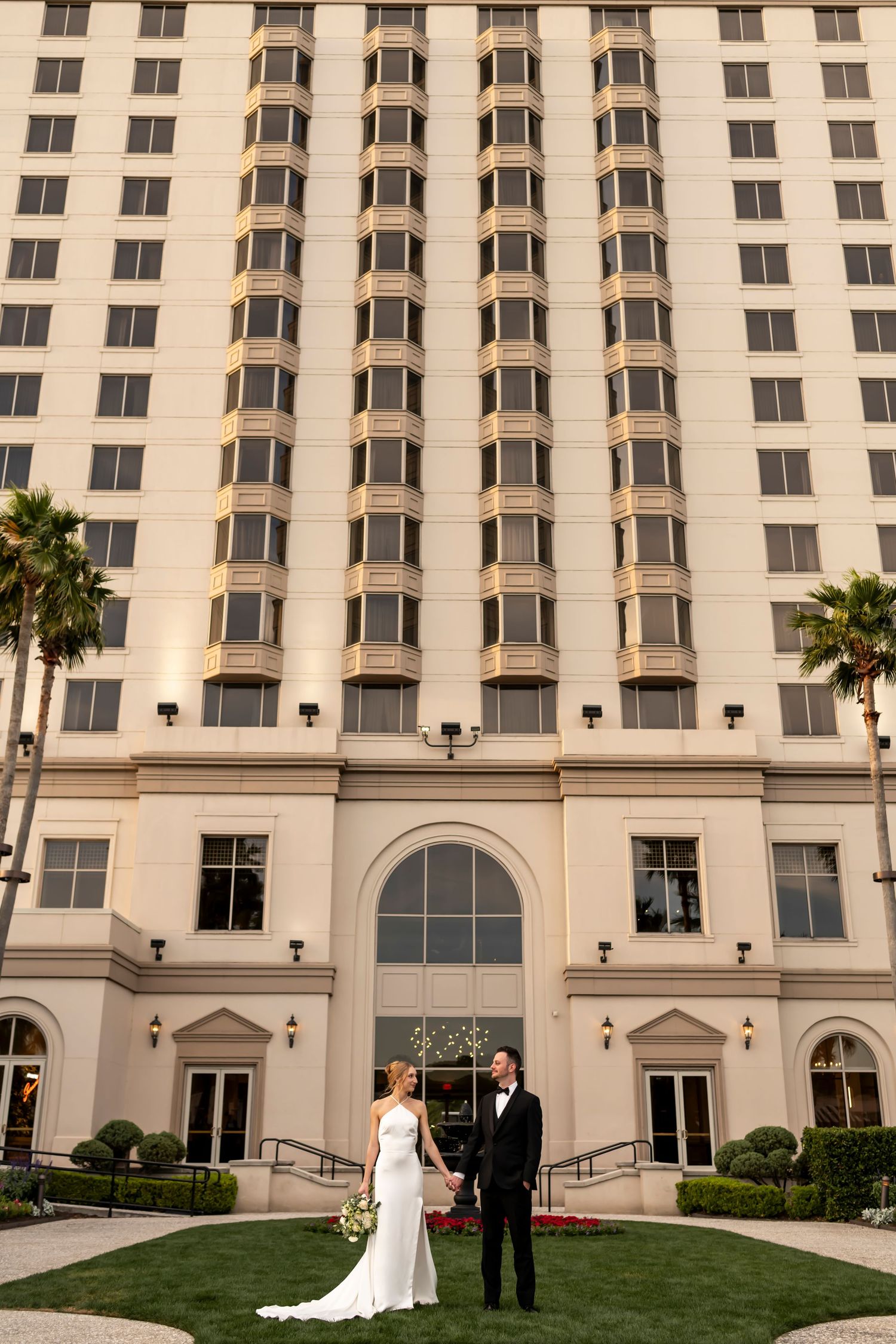 Elegant Westin Hotel in Savannah with bride and groom in the foreground.