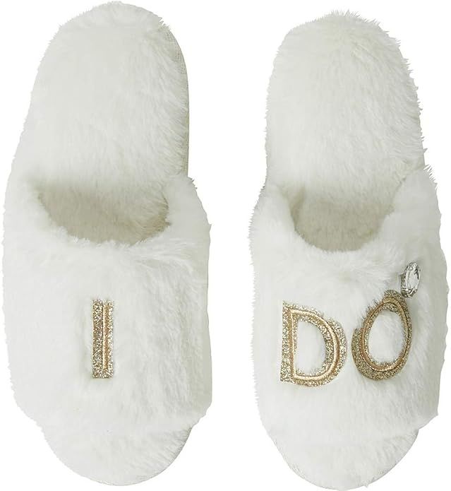 White fluffy bridal slippers with rhinestone 'I DO' text design for wedding day comfort and style.