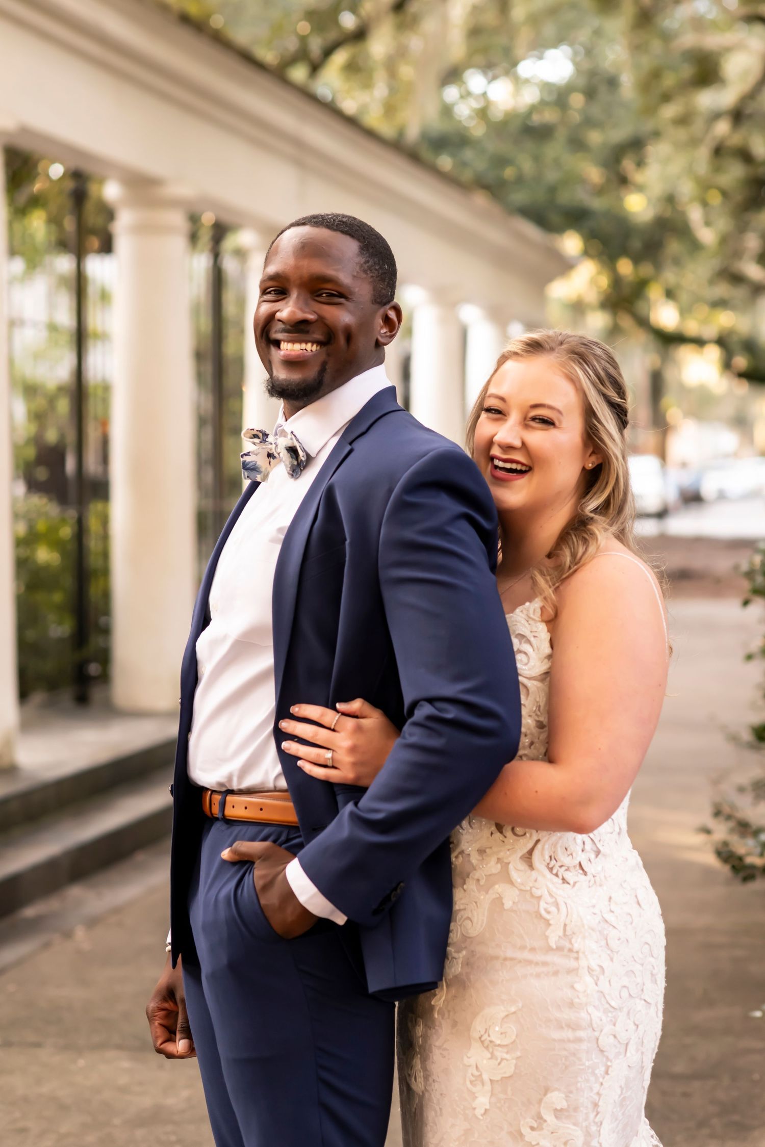 Candid photo series shows a joyful couple laughing and embracing during their outdoor wedding photoshoot.