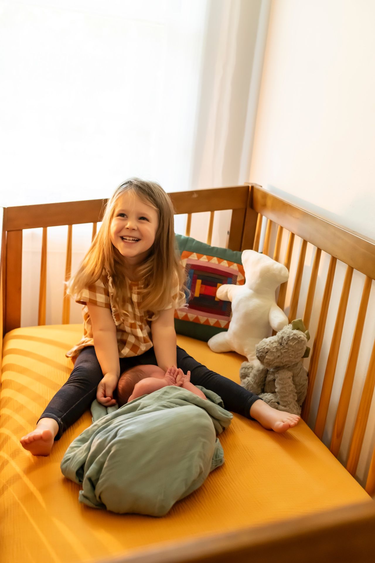 Children laying on yellow bedding with soft toy plushies in a playful four-panel sequence.