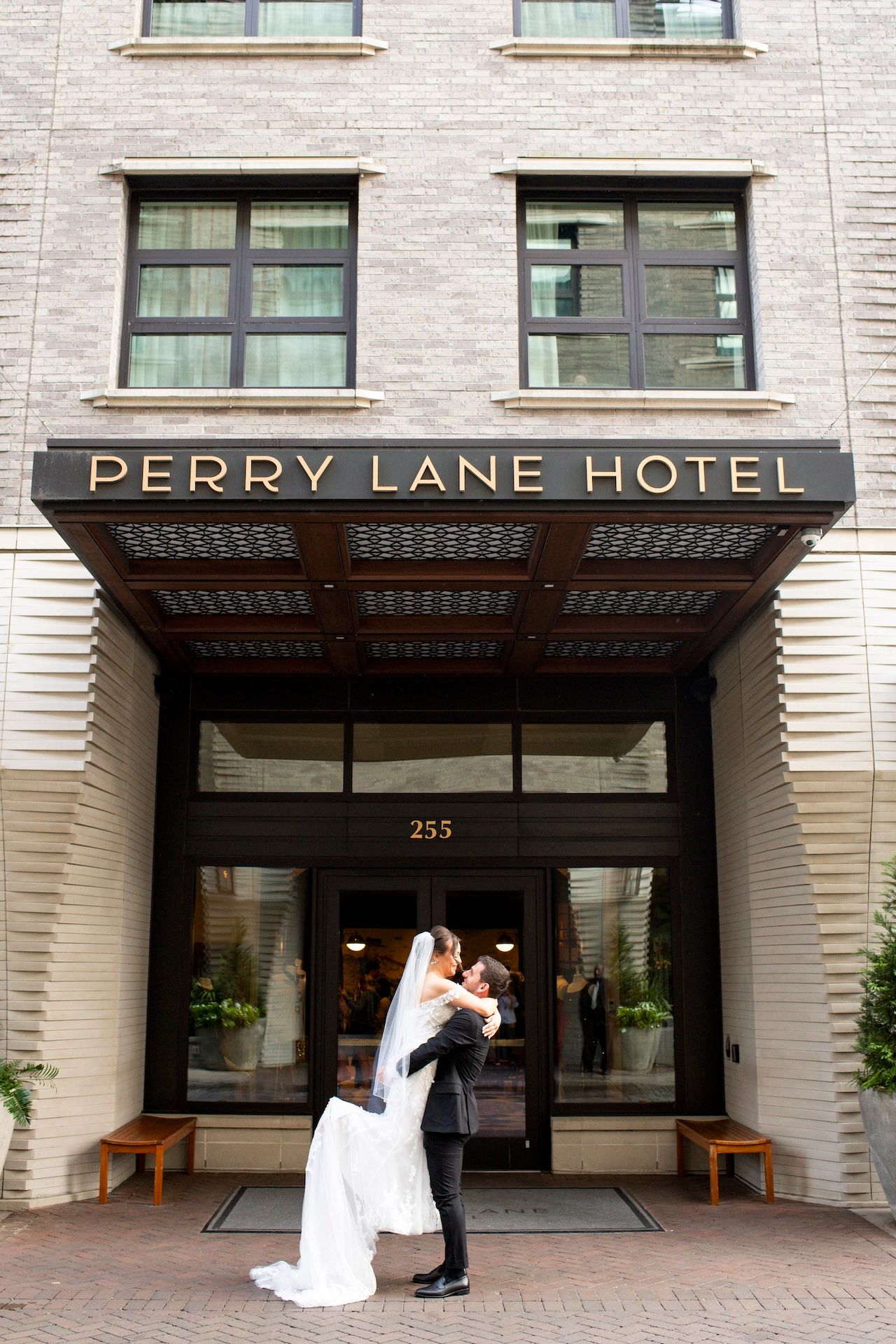 A series of photos showing the entrance to the Perry Lane Hotel with its elegant awning and modern facade.