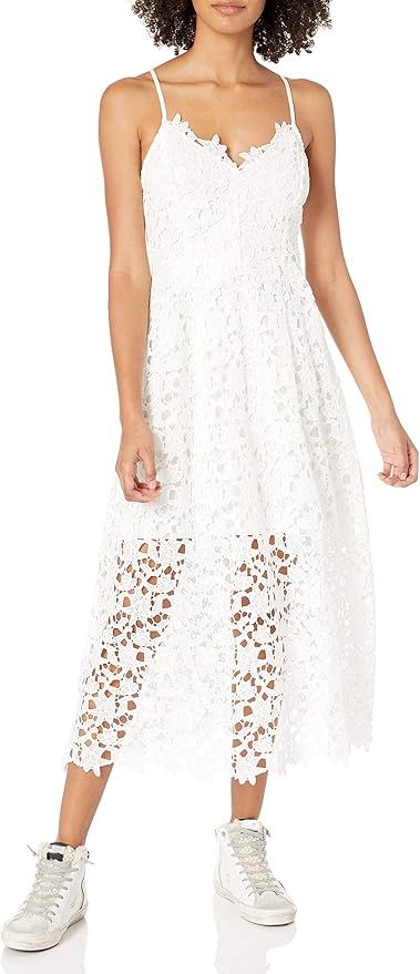 White lace midi dress with spaghetti straps and floral crochet pattern shown paired with white high-top sneakers.