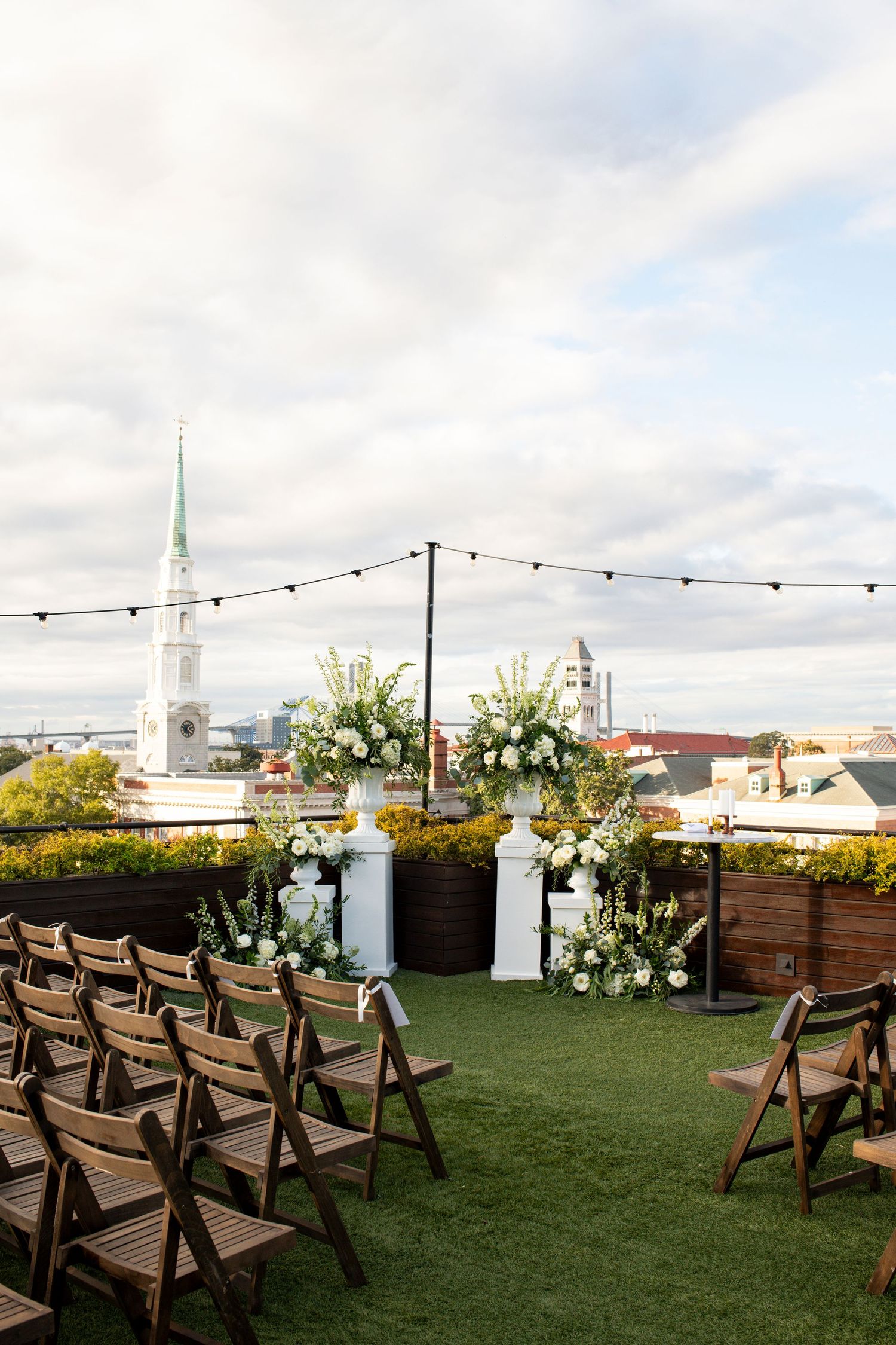 A rooftop wedding ceremony looking over Savannah, Georgia at the Perry Lane Hotel.