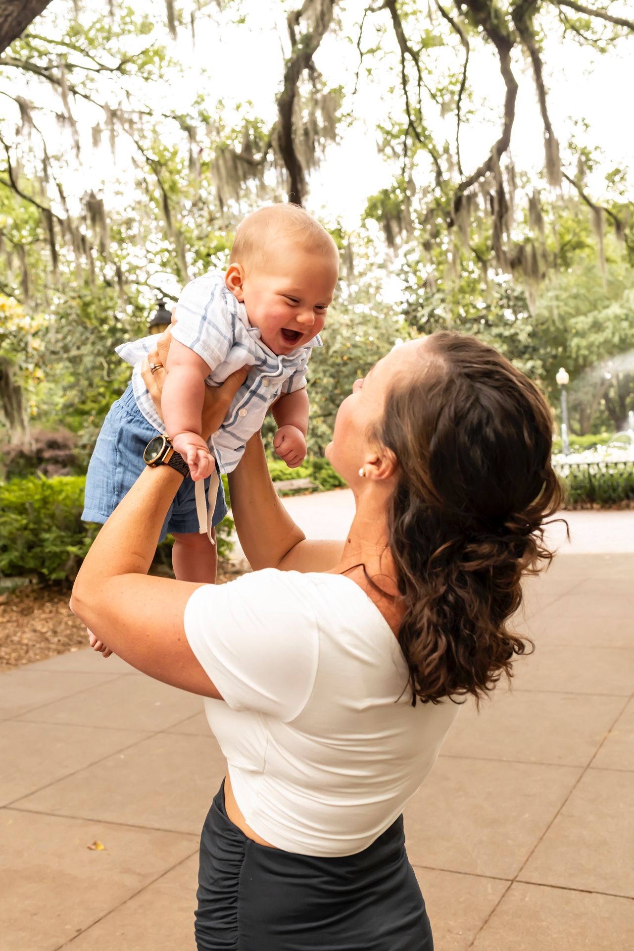 Joyful outdoor portrait sequence showing love and playtime in a garden setting.