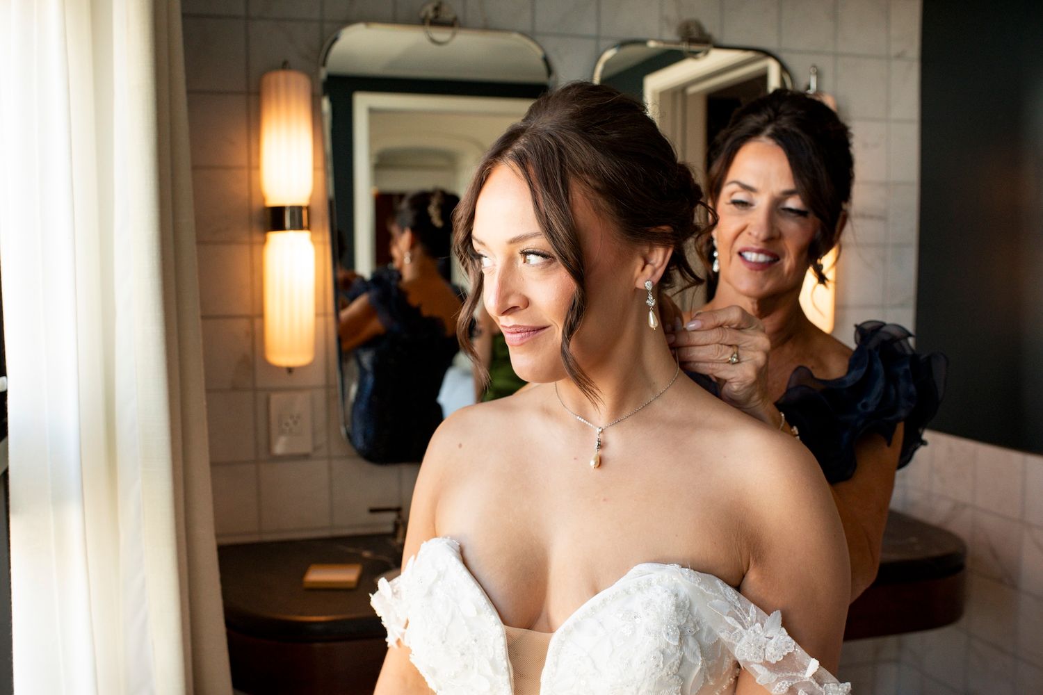 A bride and groom share a candid moment together while laughing during their wedding celebration.