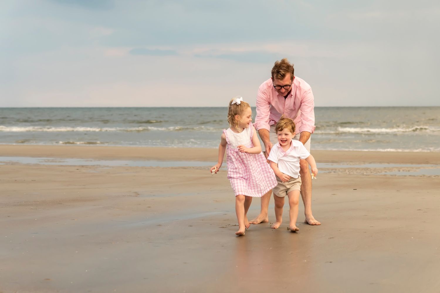 A collection of beachfront photographs showing people enjoying family time and playing together on a sandy shore.