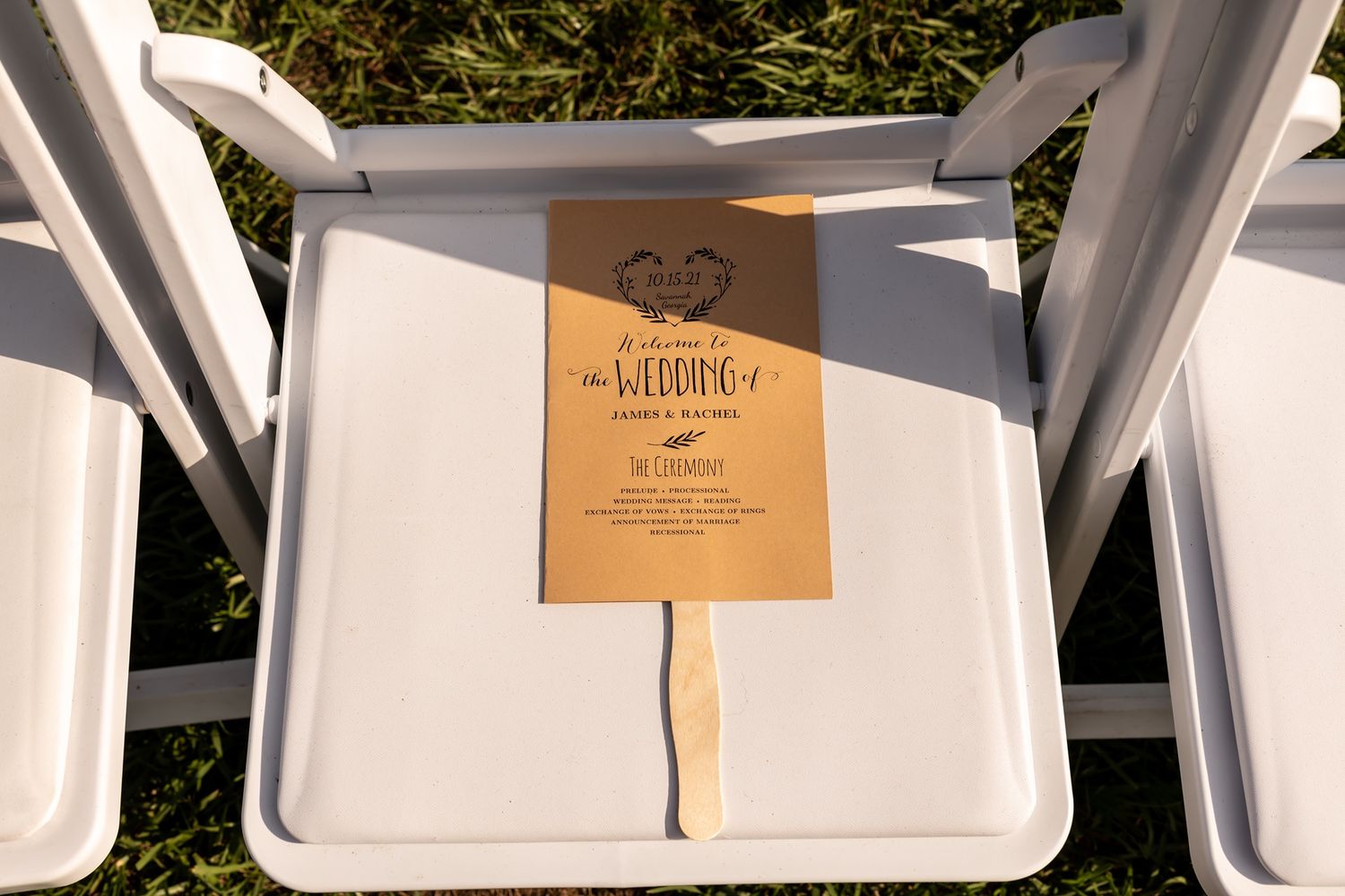White foam takeout container with wooden paddle stick showing 'The Farmer' menu or label in warm sunlight.