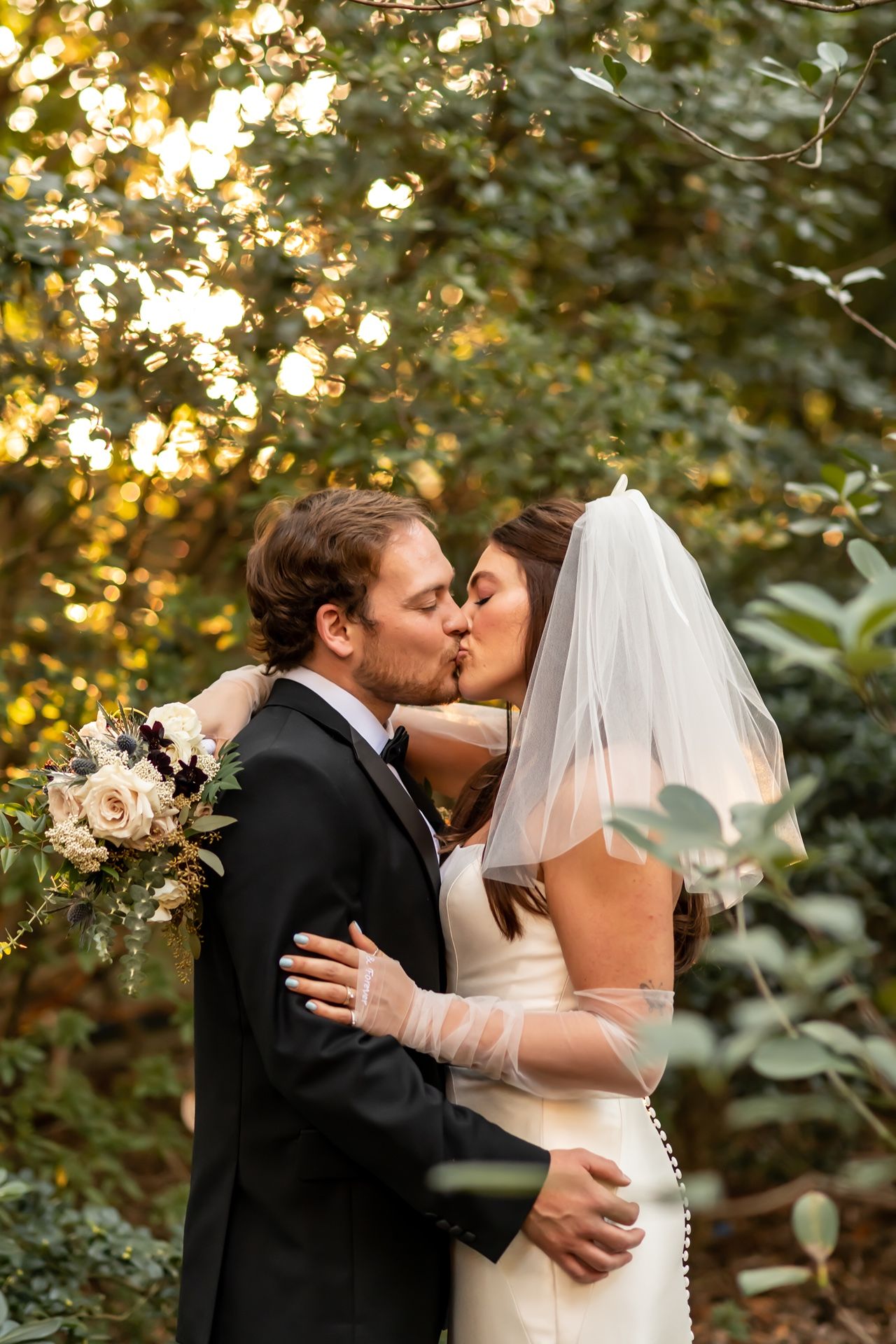 A series of intimate wedding photos capturing the couple sharing romantic kisses surrounded by golden evening light and foliage.