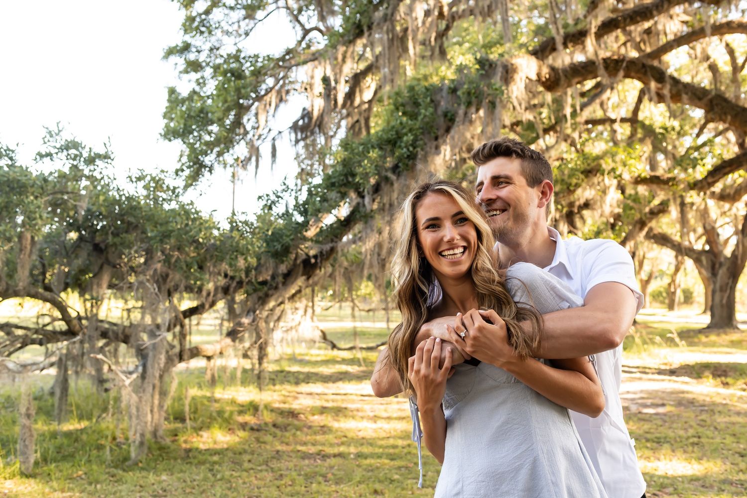 A couple shares joyful moments photographed in sequence under a majestic oak tree at golden hour.