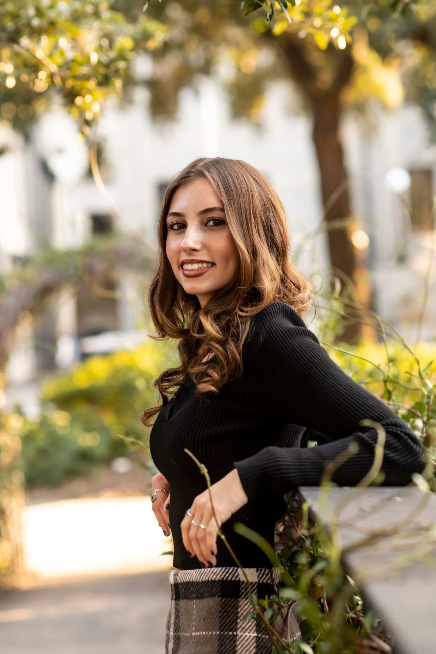 An autumn portrait amidst golden foliage and natural lighting.