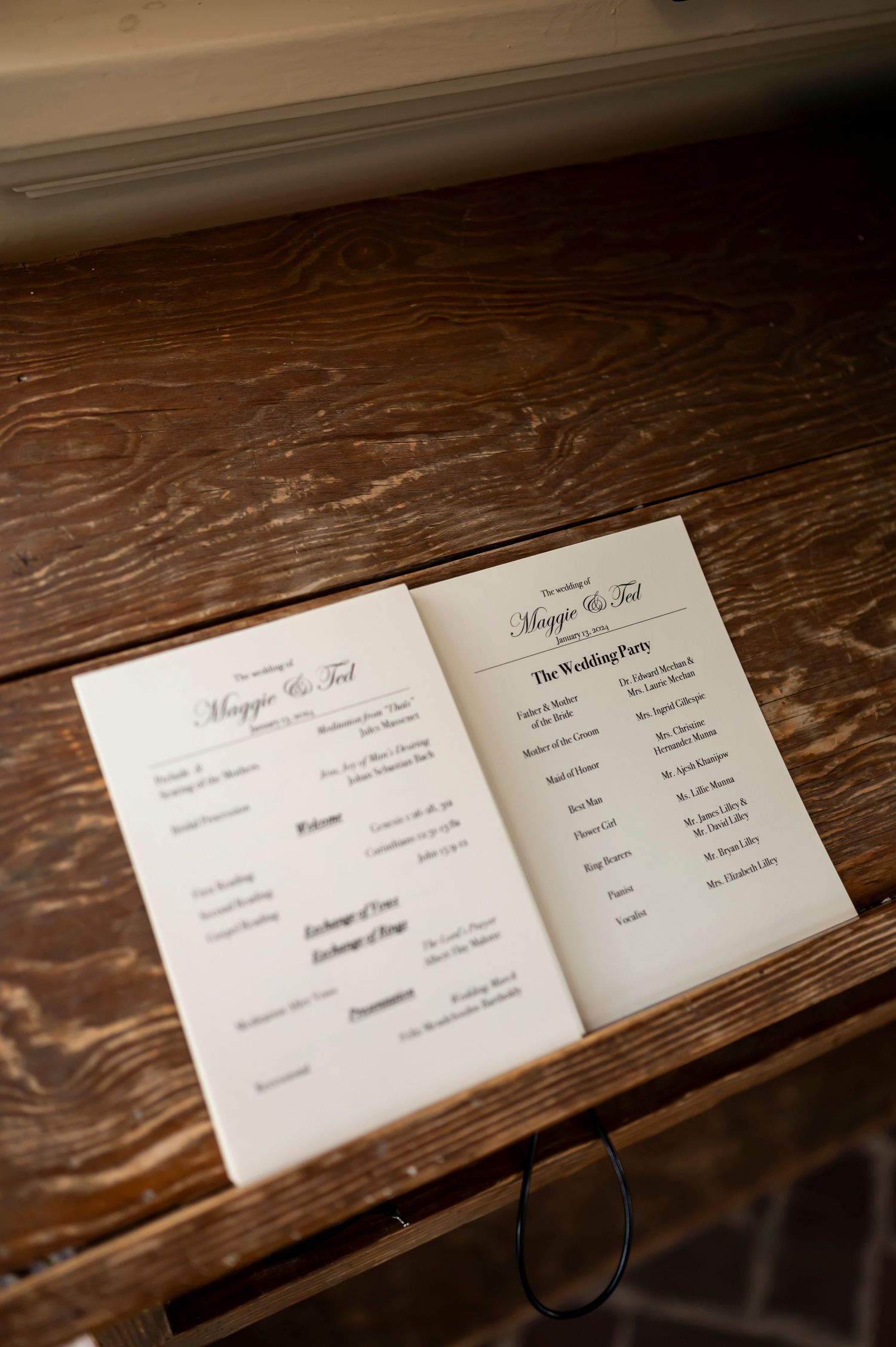 Wedding reception menu cards displayed progressively on a dark wooden surface showing different viewing angles.