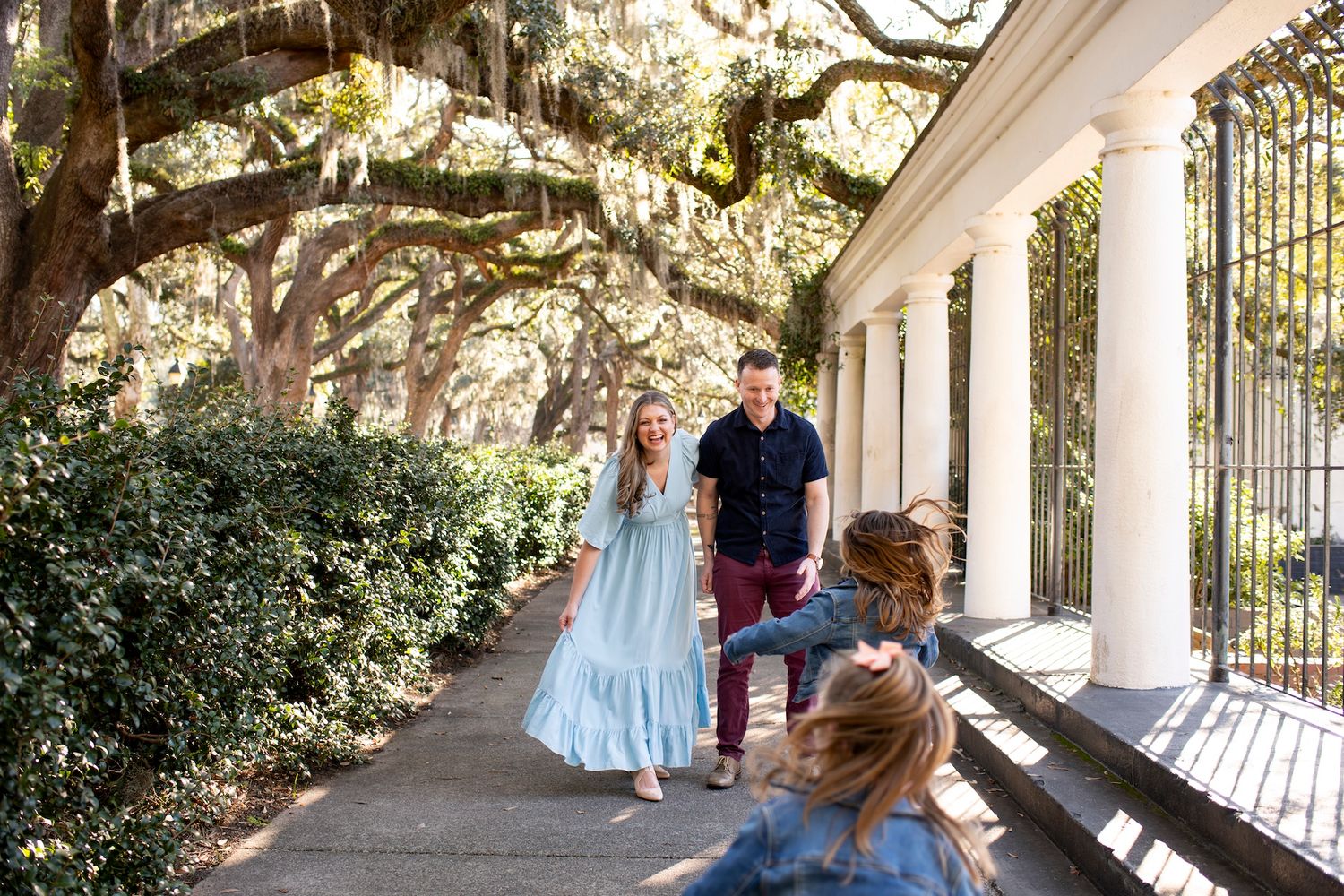 A family plays outside of the Fragrance Garden in Forsyth Park in Savannah, Georgia.