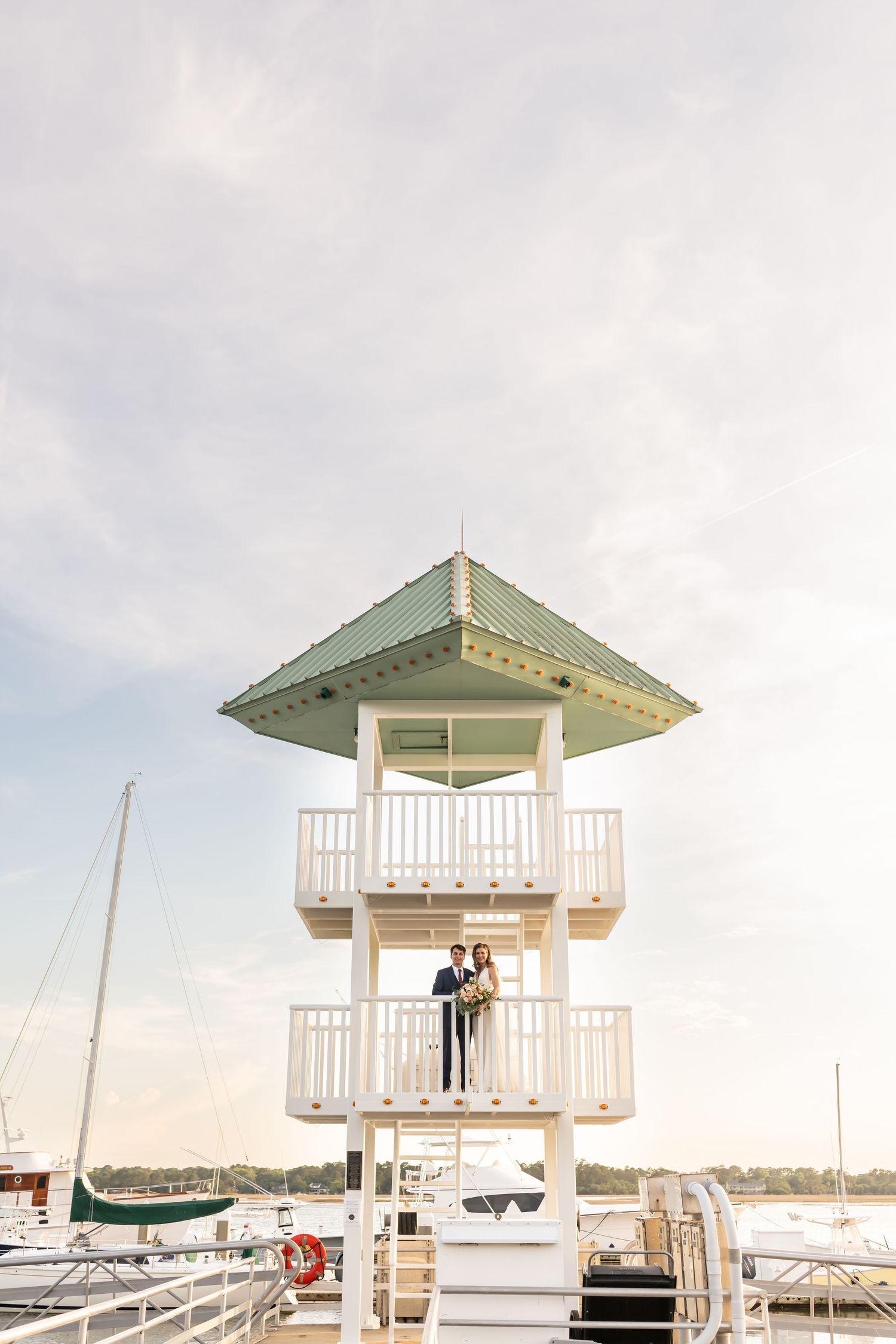 Bride and groom at their Savannah Yacht Club wedding on the dock.