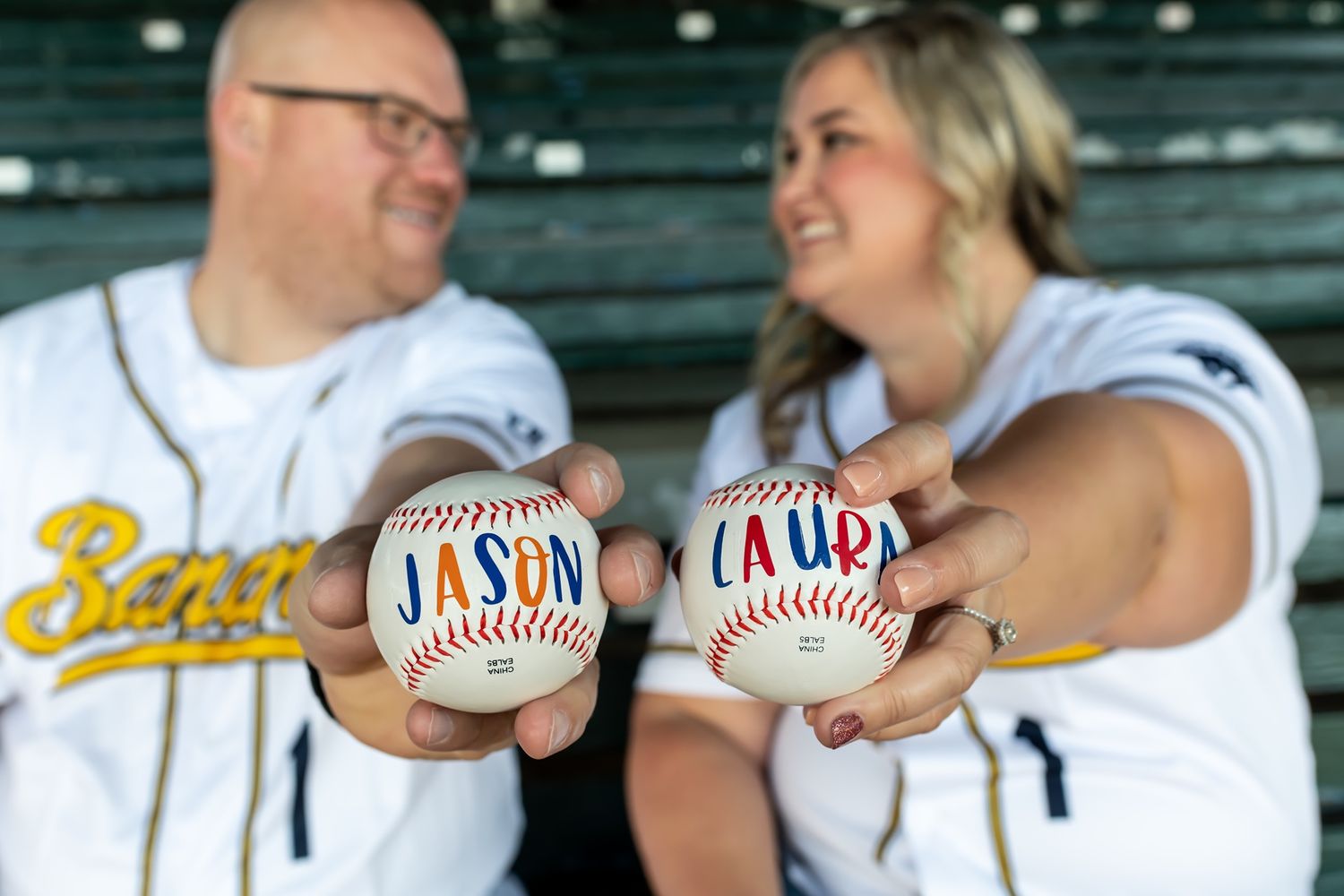 Baseball themed wedding ceremony decor features baseball cards and memorabilia on display at reception tables.