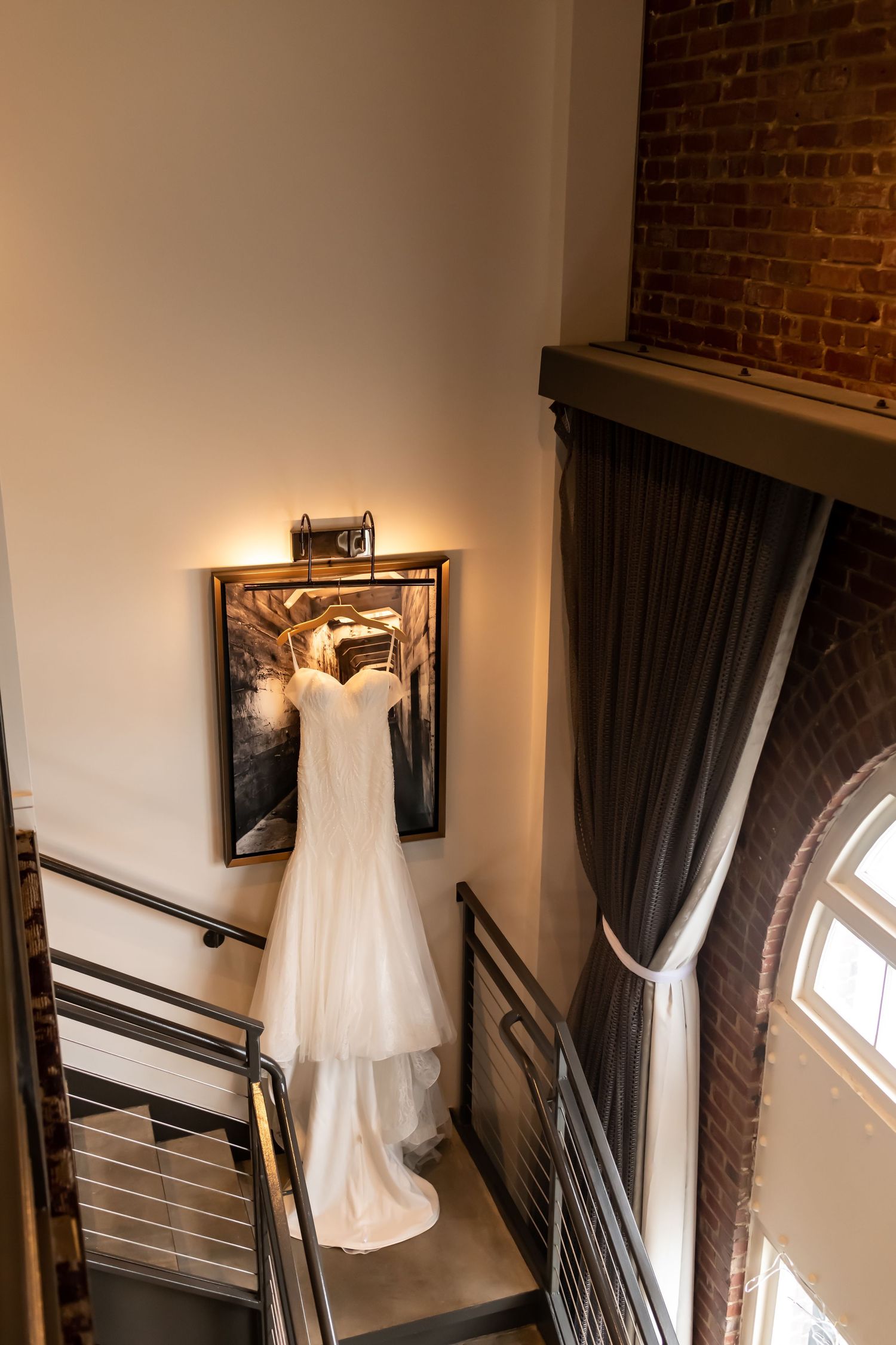 Bridal gown hanging at a JW Marriott Plant Riverside wedding.
