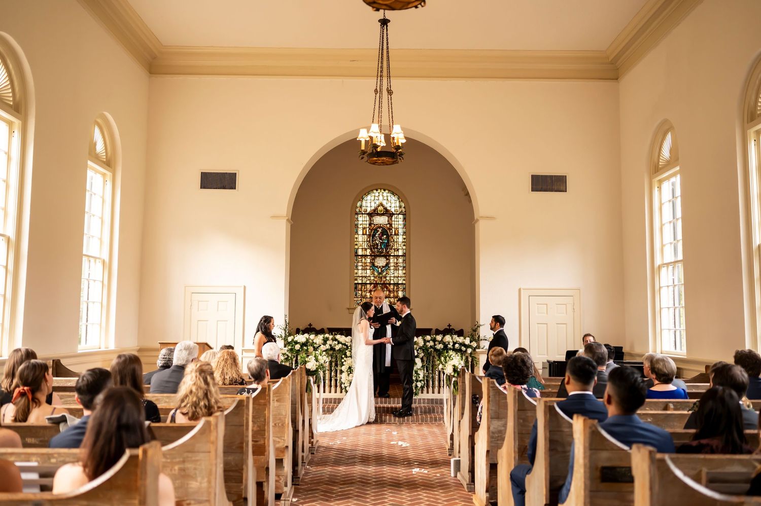 Panoramic collage of bright white church interior with multiple windows, pews, and high ceiling illuminated in natural light.