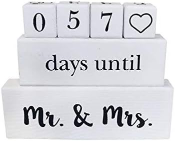 White wooden countdown blocks showing 057 days until Mr. & Mrs. with a heart symbol for wedding day countdown display.