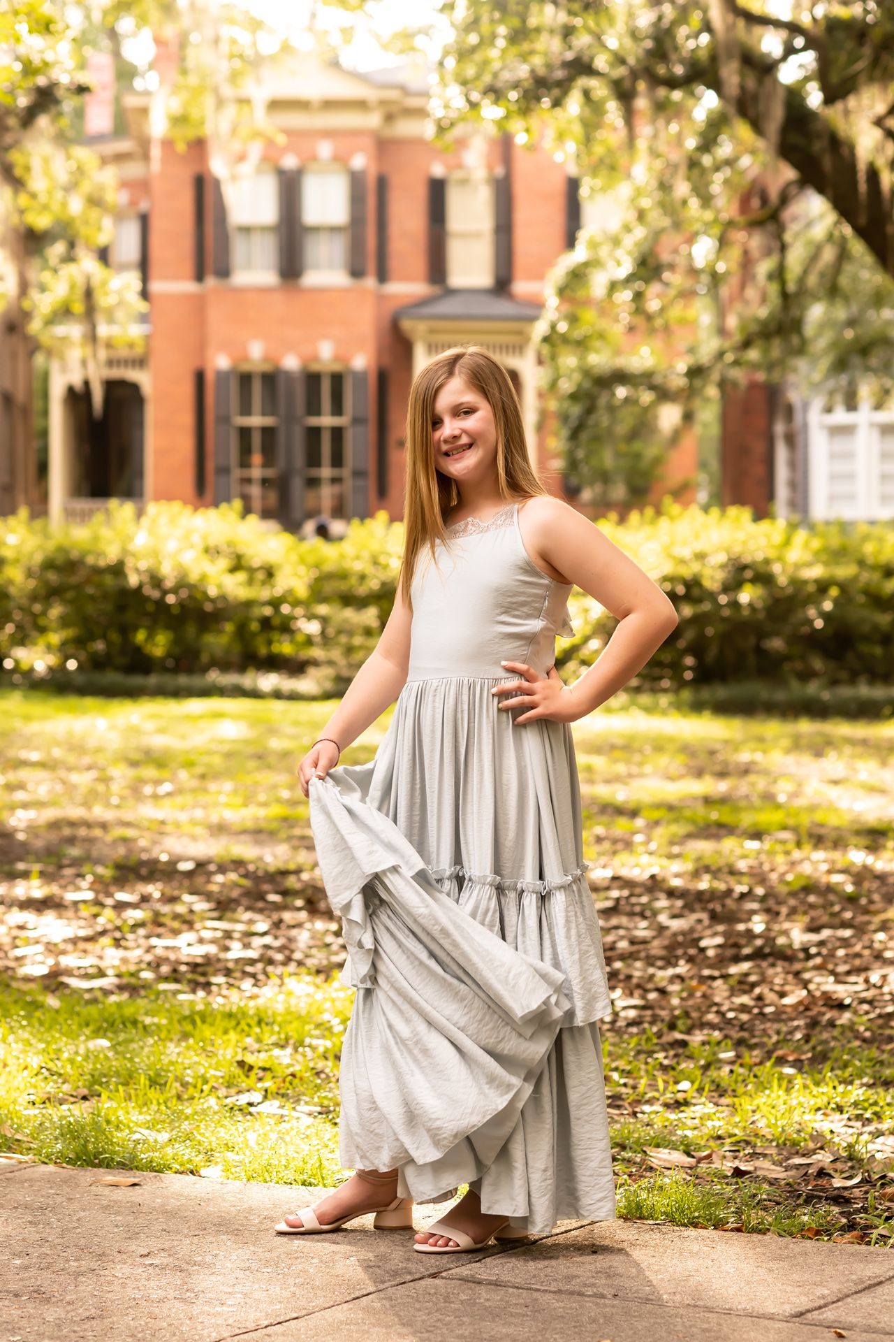 A series of photos showing a light gray ruffle dress captured in an autumn garden setting with fallen leaves.