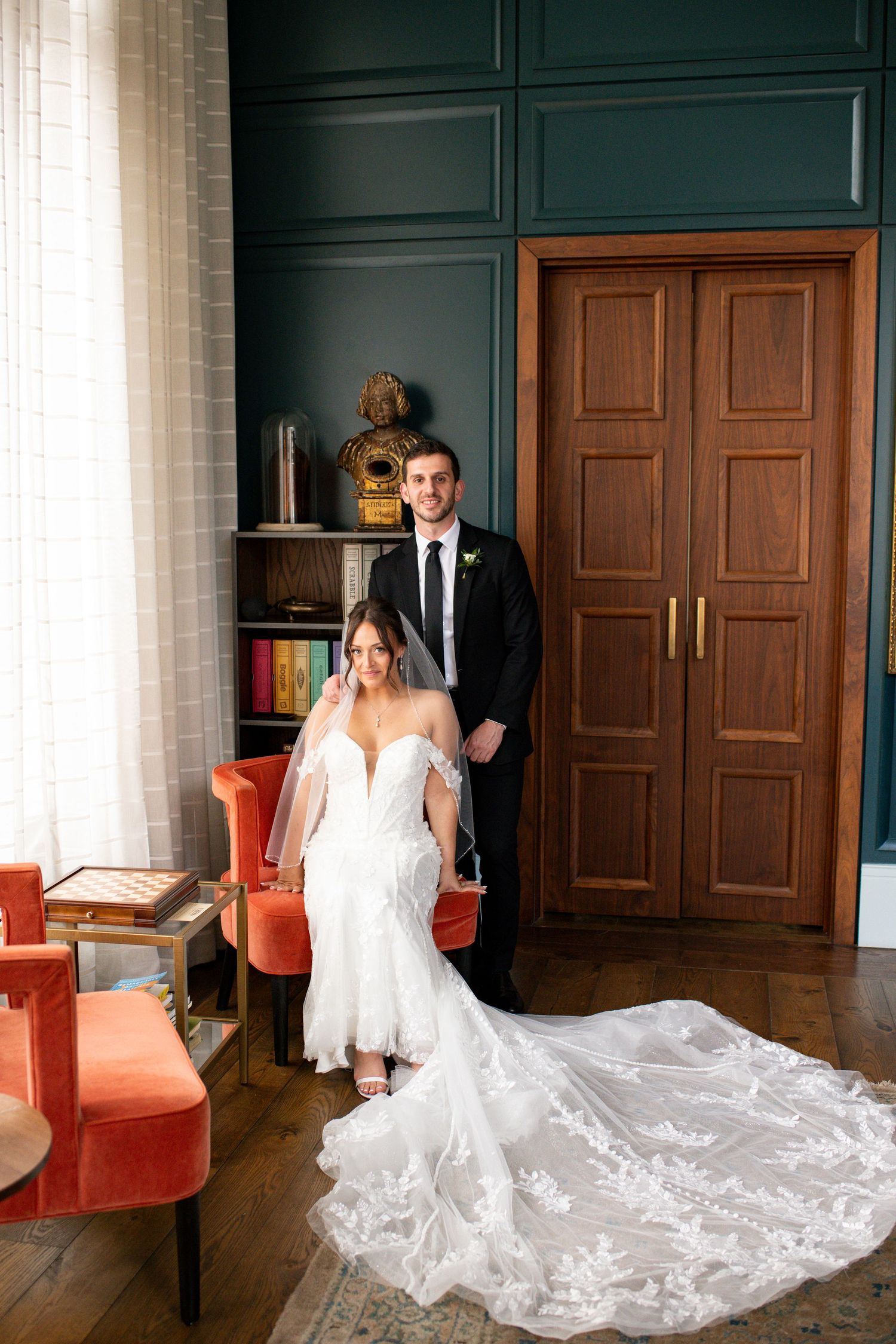 Bride and Groom portraits on their wedding day in the library at Perry Lane Hotel.