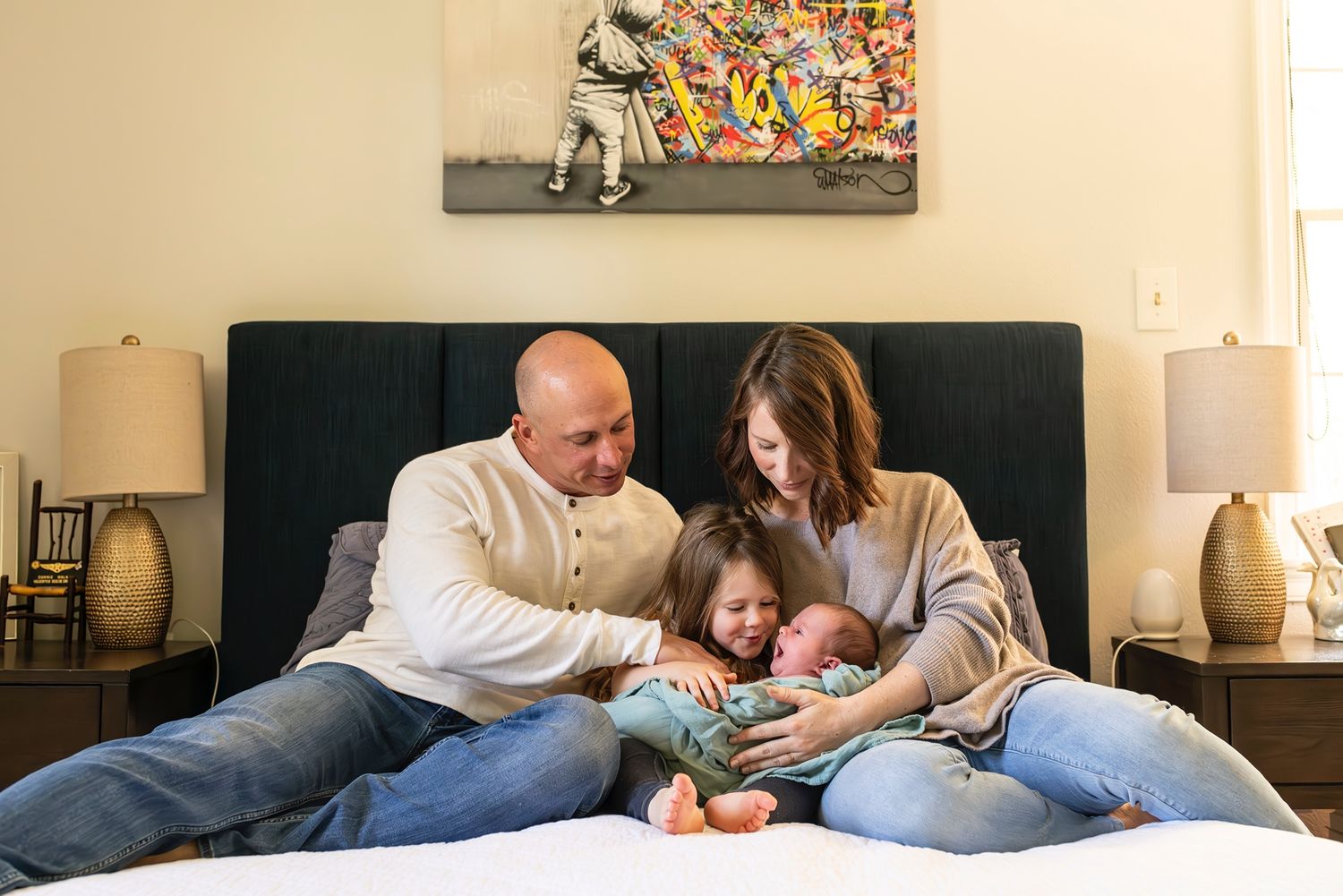Family members share tender moments together while lounging and relaxing at home in a casual setting.