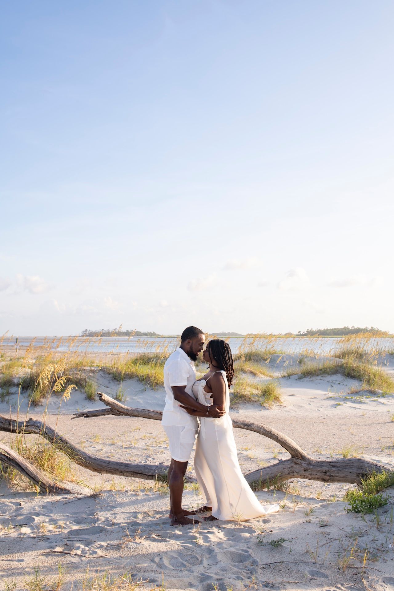 Summer beach engagement photos at Tybee Island near Savannah.
