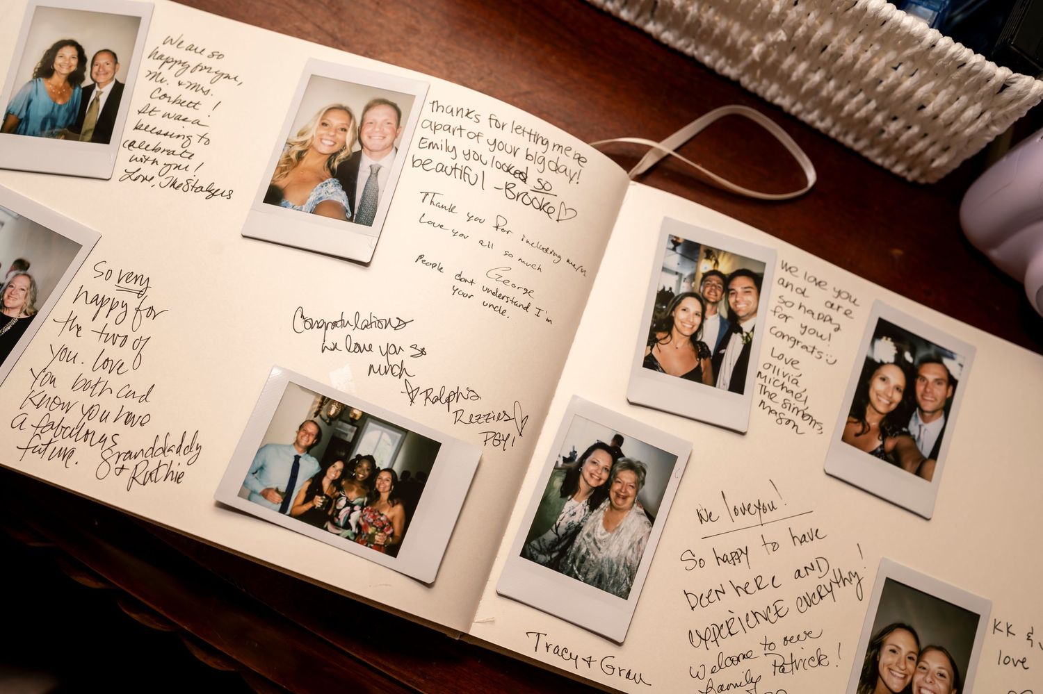 A guest book page displays polaroid photos with handwritten notes and messages on textured paper.