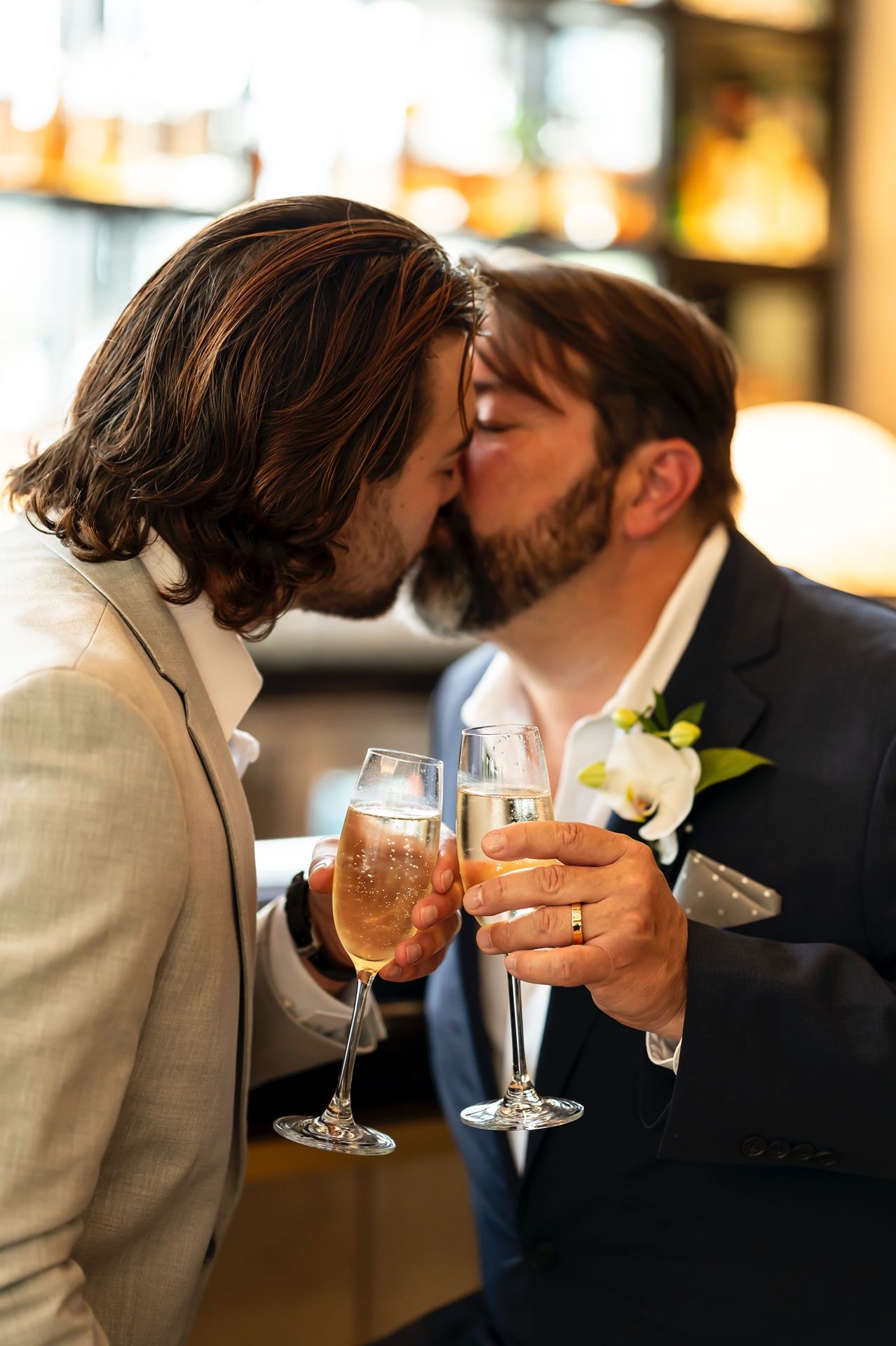 A series of intimate wedding moments showing toasts and kisses while holding champagne glasses.