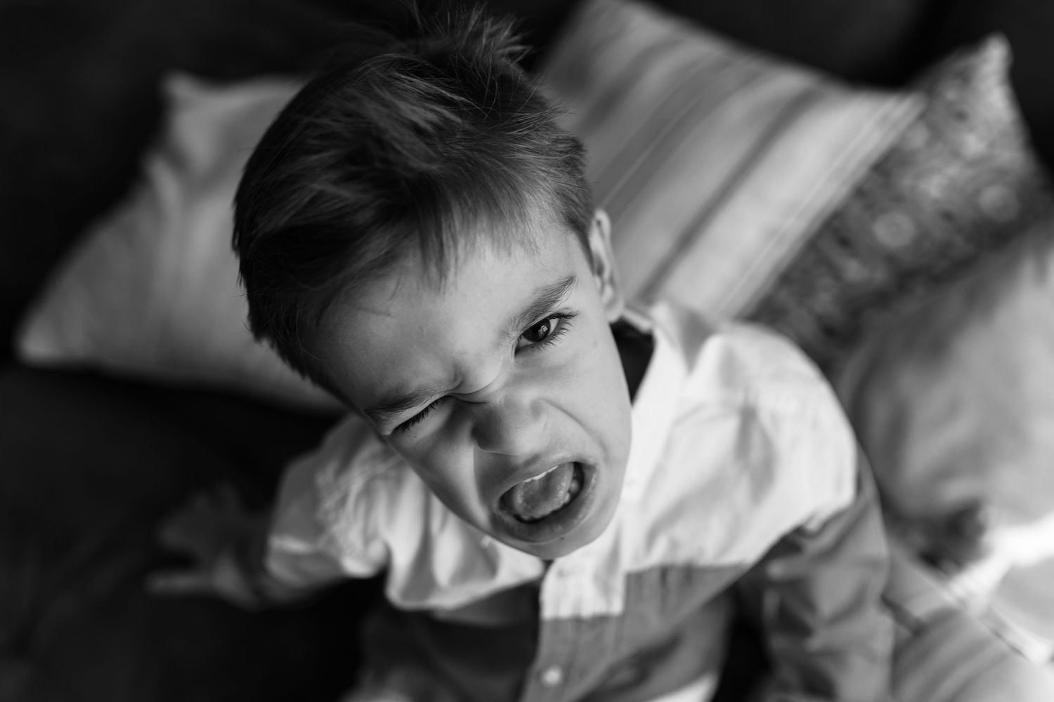 Black and white candid shots capturing playful family interactions.