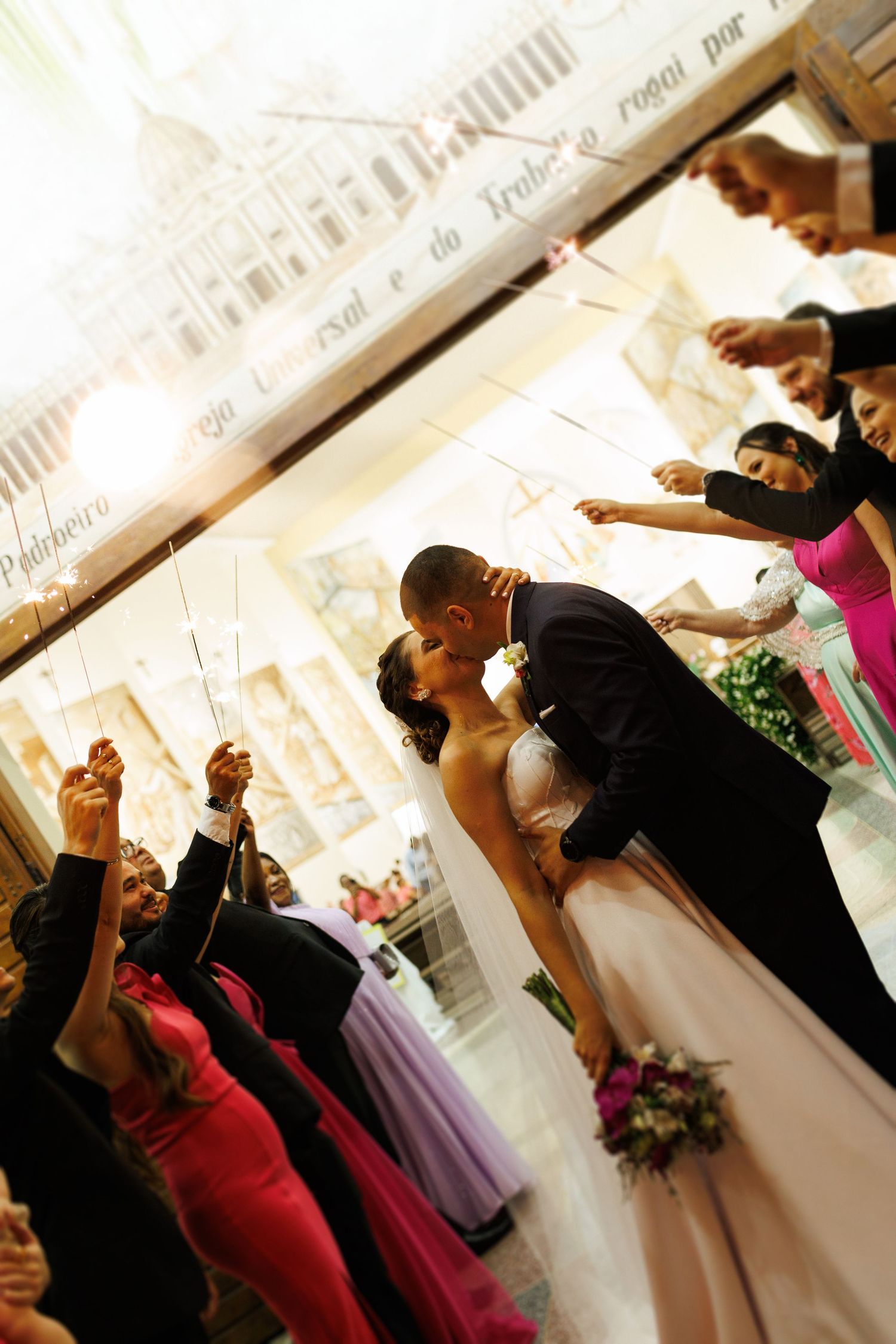 Wedding guests dancing and celebrating together at a reception party.